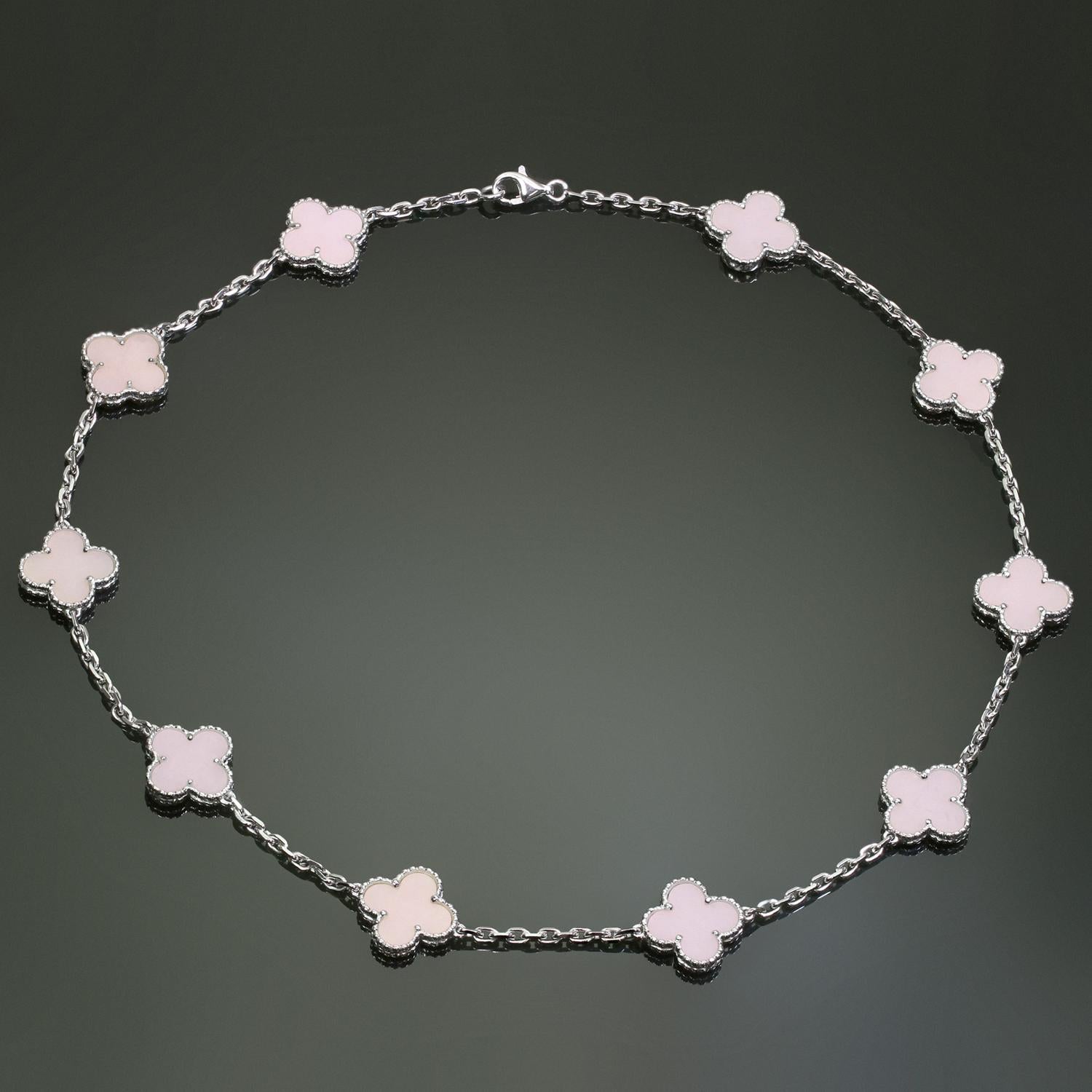 This splendid Van Cleef & Arpels necklace from the iconic Alhambra collection is crafted in 18k white gold and features 10 lucky clover motifs beautifully inlaid with natural pink opal in round bead settings. This extremely rare necklace has been