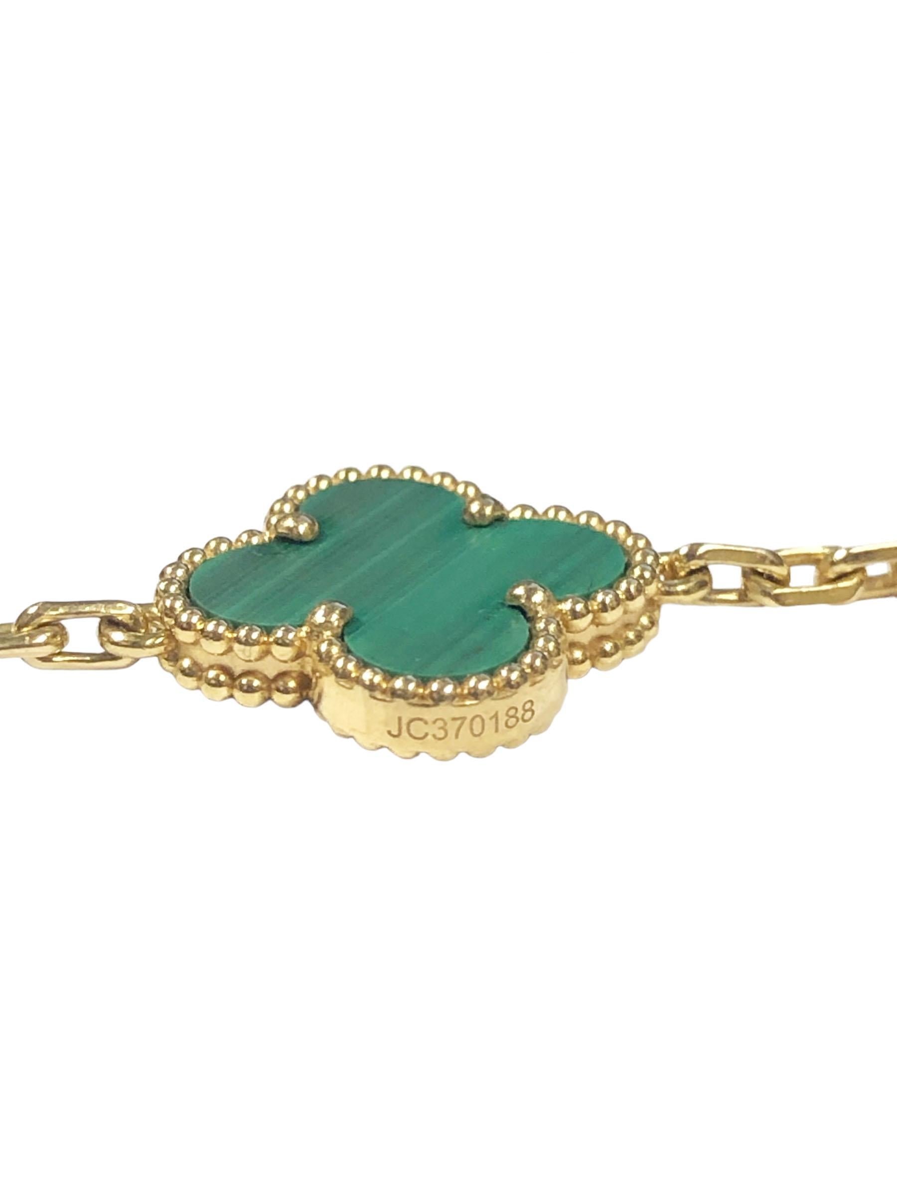 Circa 2021 Van Cleef & Arpels Alhambra Vintage 18k Yellow Gold and Malachite 5 Station Bracelet, each station measuring 9/16 X 9/16 inch and 7 3/8 inches in length. This is complete with Presentation box, outer box, certificate and booklet.