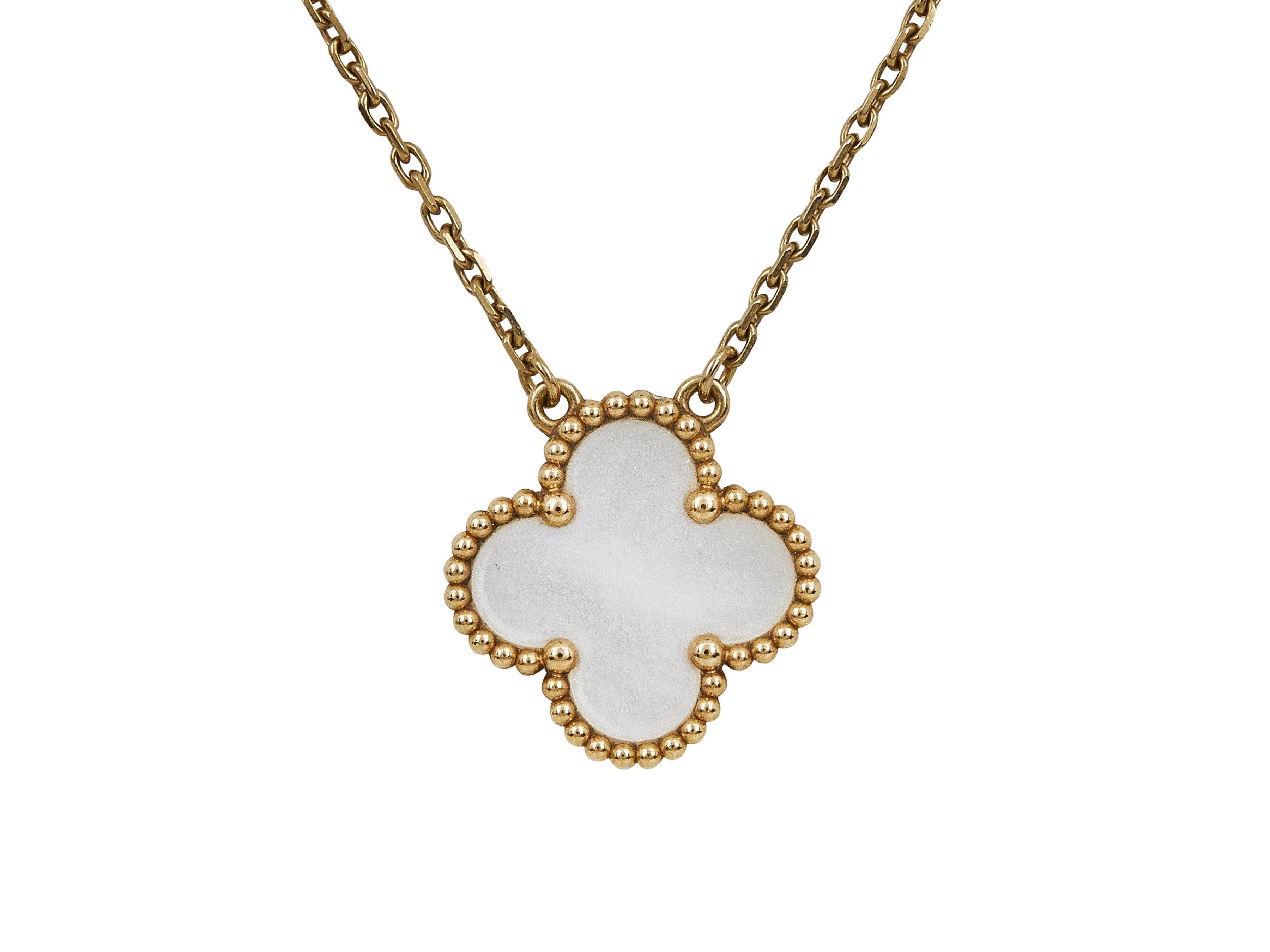 The necklace: A Van Cleef & Arpels Alhambra Vintage pendant necklace. Designed as a single mother of pearl motif set in beaded eighteen karat yellow gold on a delicate chain. The chain can be worn at two different lengths.

The necklace is in