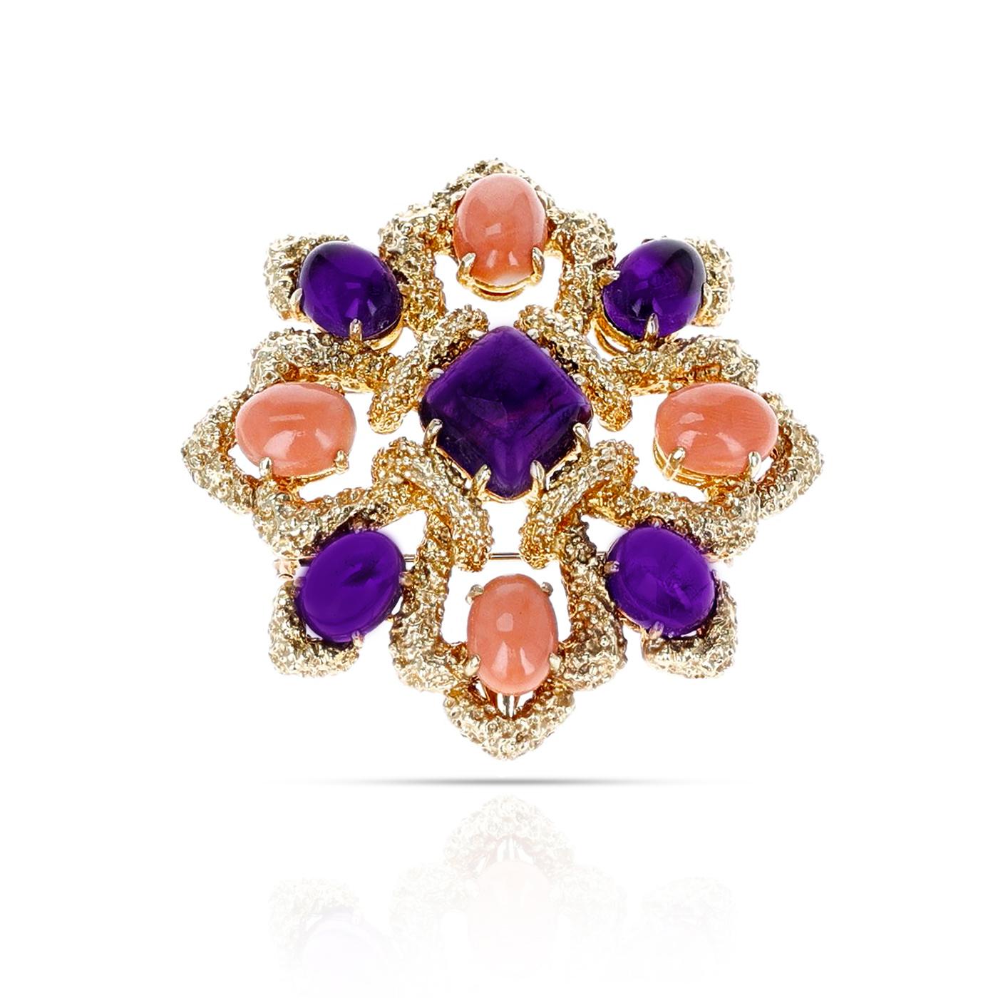 A magnificent Van Cleef & Arpels Amethyst and Coral Cabochon Brooch made in 18 Karat Yellow Gold. The total weight of the brooch is 63 grams. 
