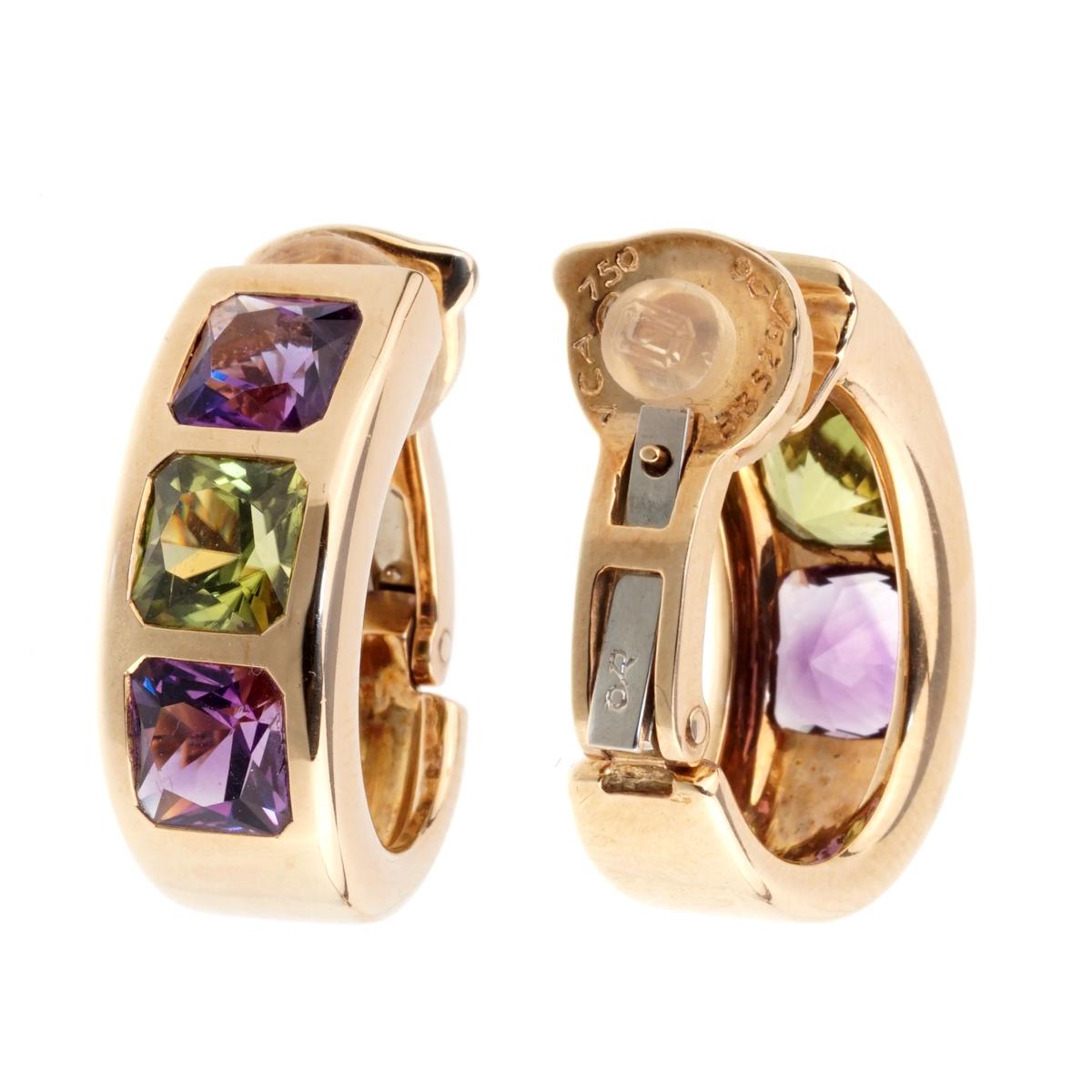 A fabulous pair of Van Cleef & Arpels earrings featuring amethyst and peridot set in 18k yellow gold.