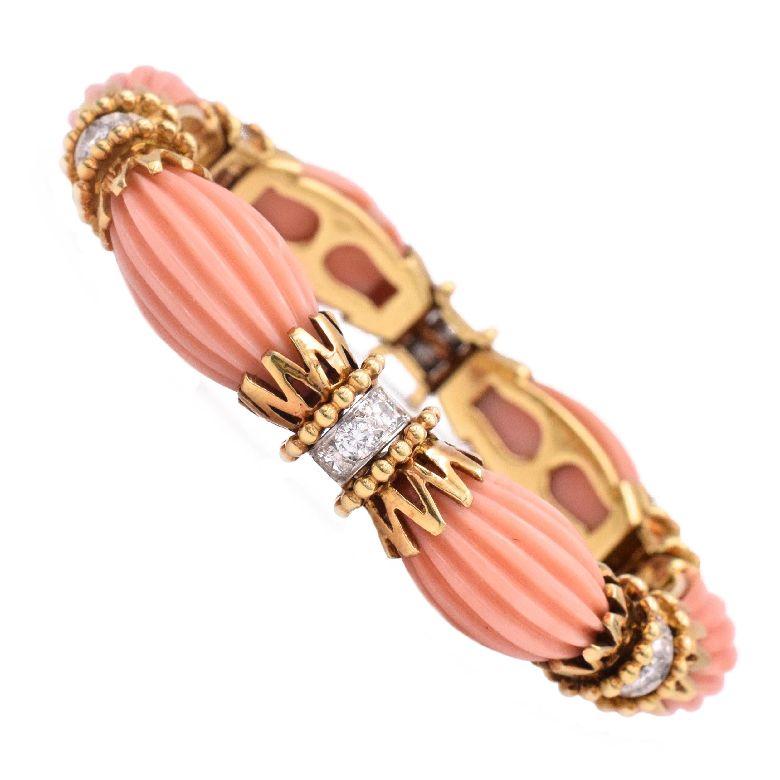 Van Cleef & Arpels Angel Coral & Diamond Bracelet
 Composed of fluted carved coral links, spaced by gold motifs, highlighted with round diamonds. Diamonds, estimated to weigh a total of approximately 1.60 carats.
 Internal circumference is 61⁄4
