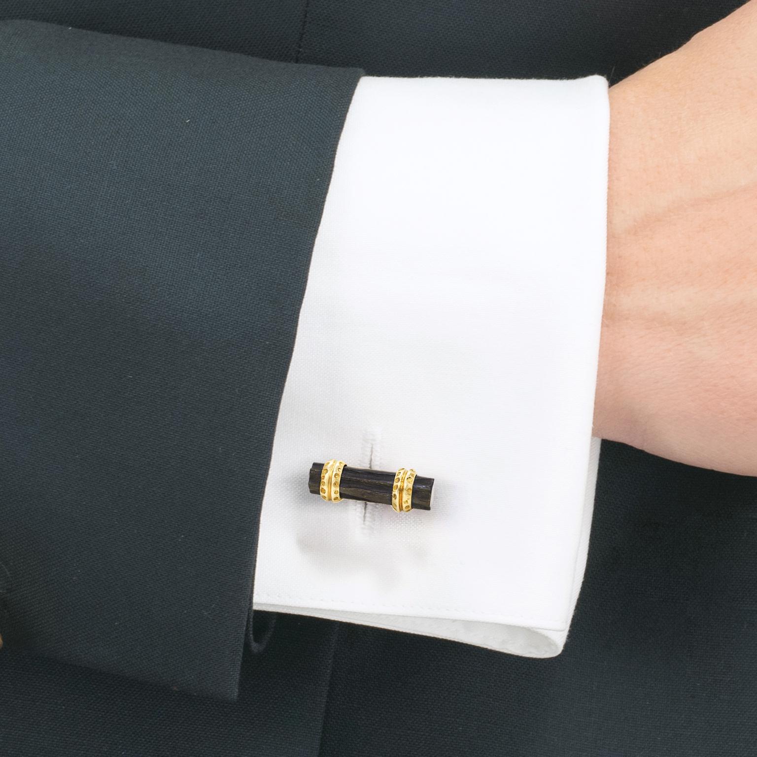 Circa 1960s 18k, by Van Cleef and Arpels, France.  VCA is known for stylishly elegant cufflinks ... Well, for stylishly elegant everything! Set with carved black coral in a brutalist motif, these urbane examples of their work are perfect for any