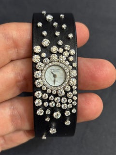 Montre-bracelet pour femme Van Cleef & Arpels en cuir noir, or 18 carats et quartz serti de diamants