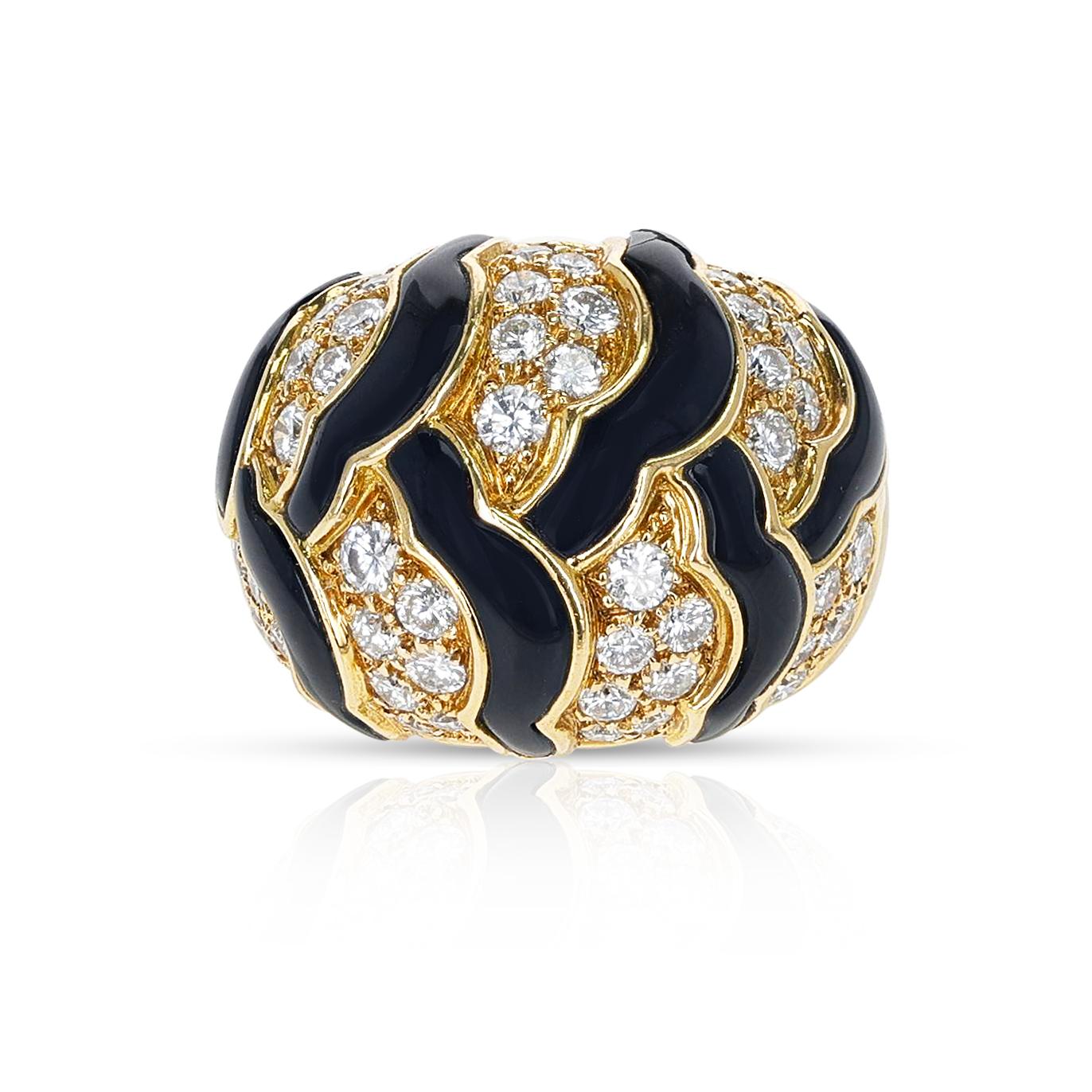 A bold and beautiful Van Cleef & Arpels Black Onyx and White Diamonds Dome Cocktail Ring made in 18 Karat Yellow Gold. The ring size is US 5.75. The total weight of the ring is 22.04 grams. 