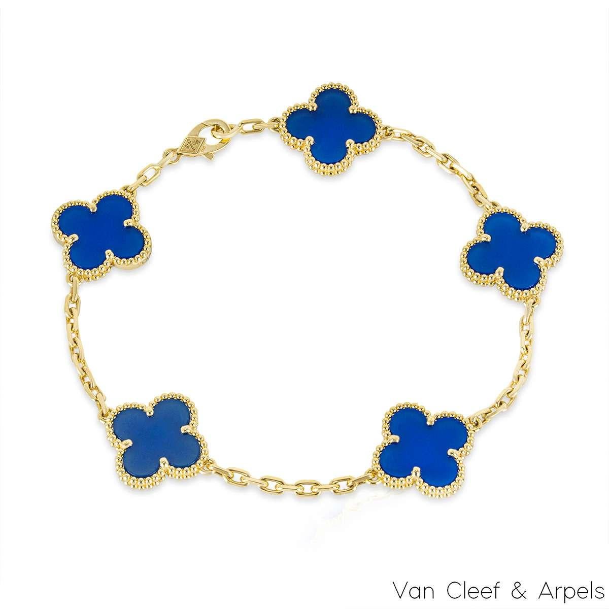 A gorgeous 18k yellow gold blue agate bracelet from the Vintage Alhambra collection by Van Cleef and Arpels. The bracelet is made up of 5 iconic clover motifs, each set with a beaded edge and a blue agate inlay, set throughout the length of the
