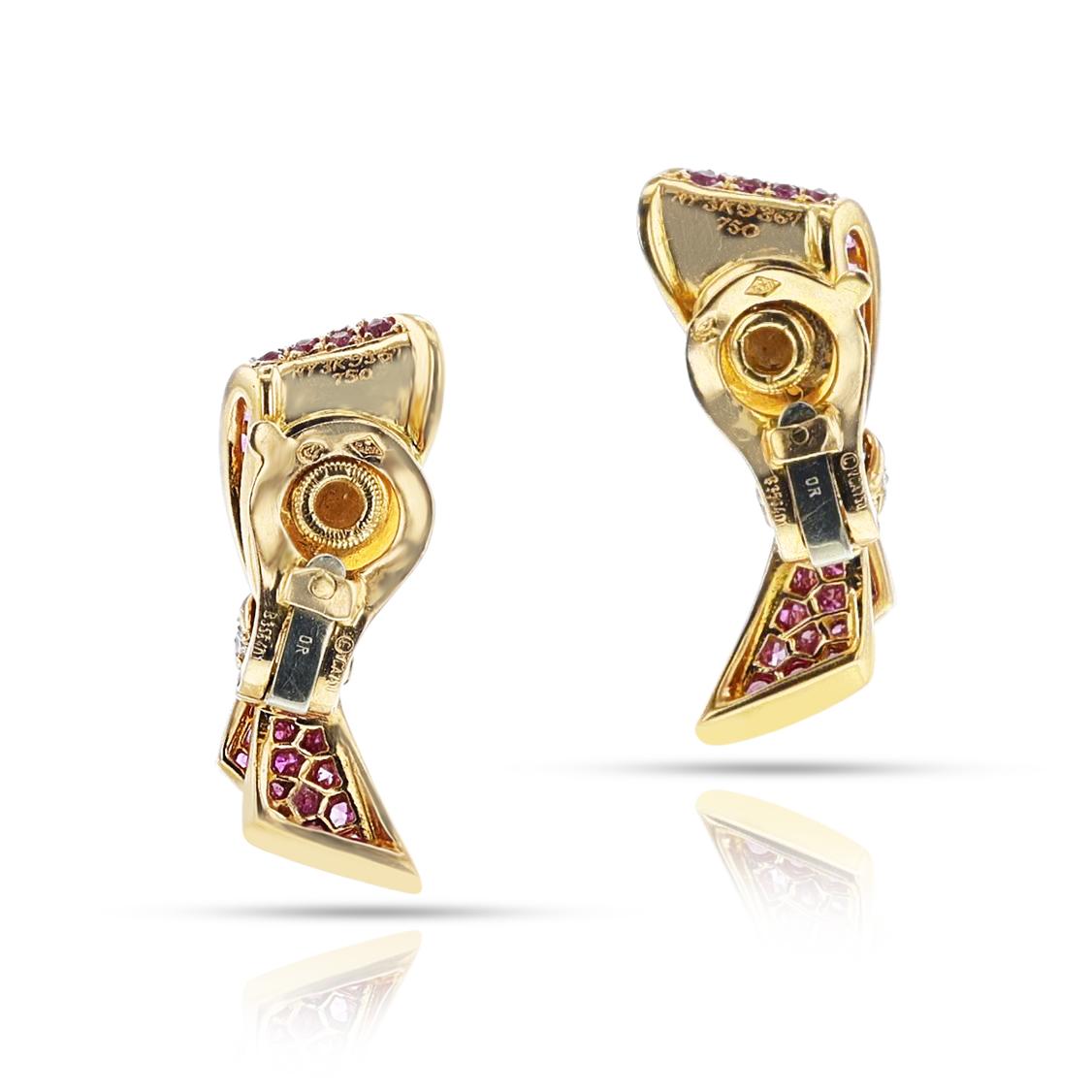 A pair of beautiful Van Cleef & Arpels Bow Earrings with Pink Sapphires and Diamonds. The Pink Sapphires weigh appx. 2.07 carats and the Diamonds weigh appx. 0.20 carats. The length is 1.18.