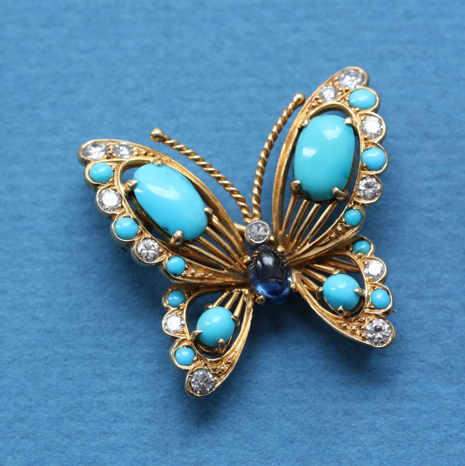 An 18-carat gold butterfly clip brooch set with cabochon-cut turquoises in its wings and a sapphire body. The wings also contain brilliant-cut diamonds, France, signed and numbered: Van Cleef & Arpels, 68335B, 1953.

Weight: 7.5 grams
Dimensions: 3