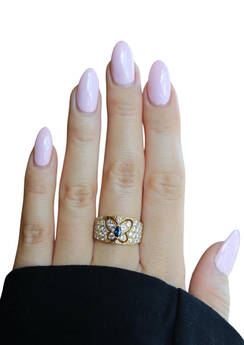 Van Cleef & Arpels Butterfly Sapphire Diamond Ring 18K Yellow Gold

This 18k yellow gold ring by Van Cleef & Arpels captures the house’s signature blend of refinement and artistry. A cluster of round white diamonds gathers across the band, catching