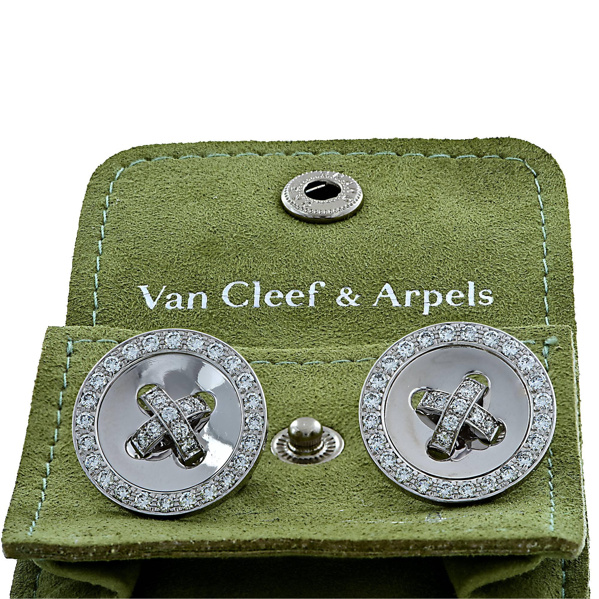 18k white gold Van Cleef & Arpels button earrings featuring 66 round brilliant cut diamonds weighing approximately 1.9cts total F color VS clarity.

Measure 20.5mm in diameter 
It is stamped and/or tested as 18k gold.
The metal weight is 16.40