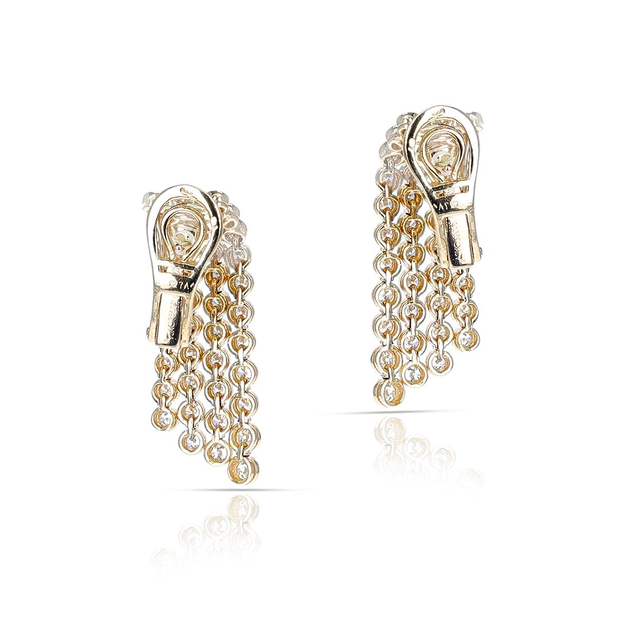 A beautiful pair of elegant Van Cleef & Arpels Four Line Diamond Cocktail Earrings made in 18K Yellow Gold. The length is 1.30