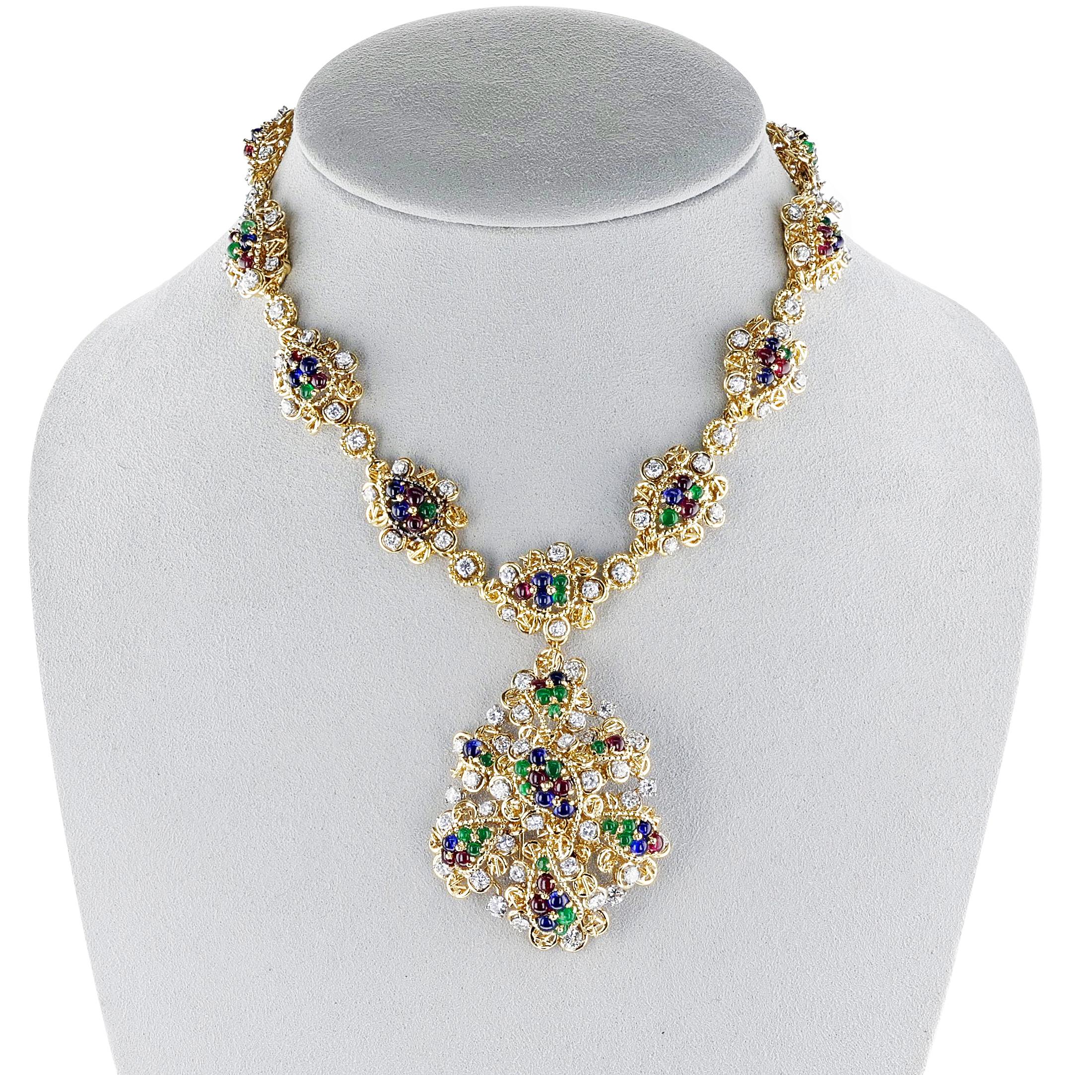 A  Van Cleef & Arpels Ruby, Emerald, Sapphire and Diamond Pendant Necklace in 18k Yellow gold. The necklace weighs 139.17 grams. The dimensions of the brooch is 2.25