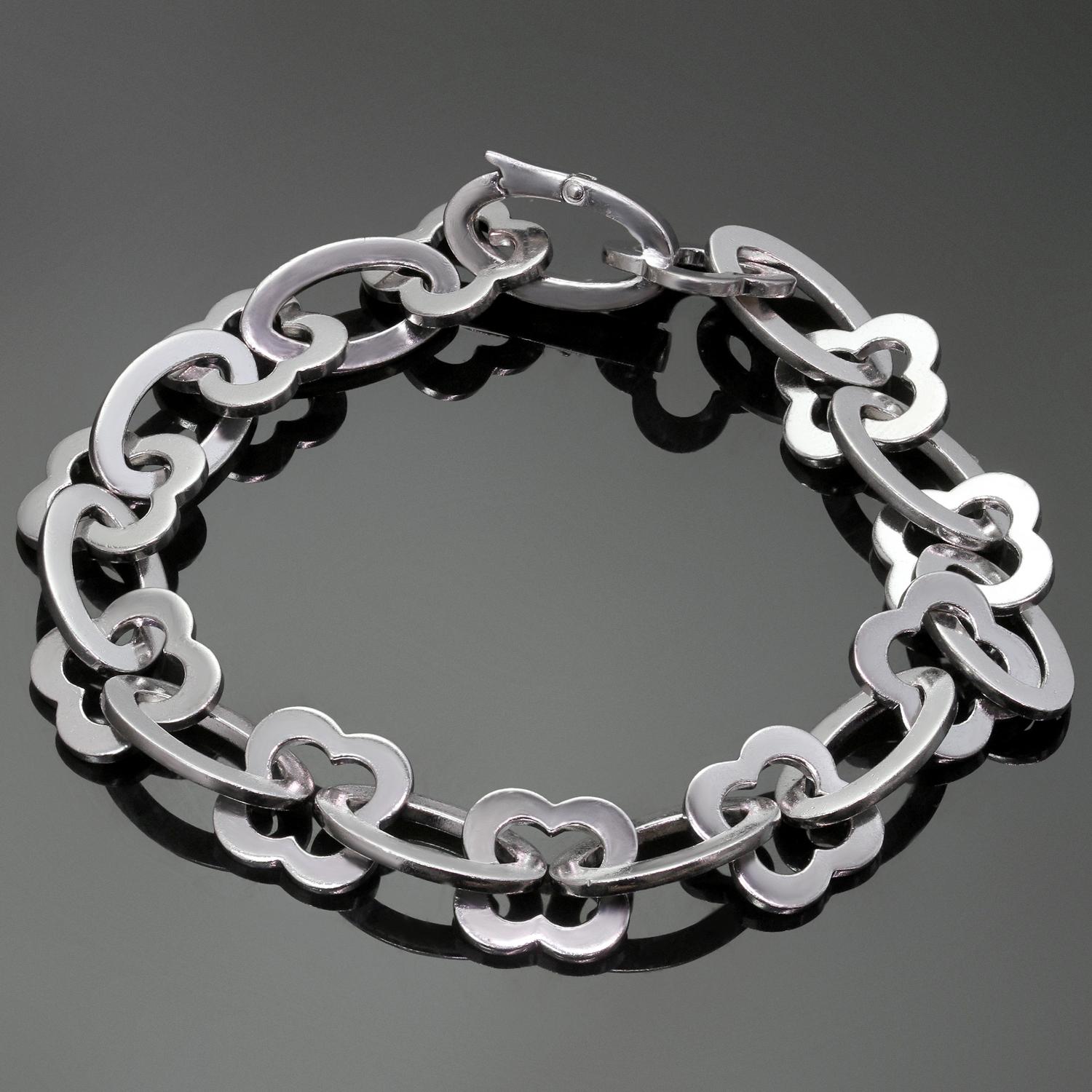 This classic bracelet from the iconic Byzantine Alhambra collection by Van Cleef & Arpels is crafted in 18k white gold and features a series of polished gold openwork Alhambra links, spaced by polished gold oval links. Made in France circa 1990s.