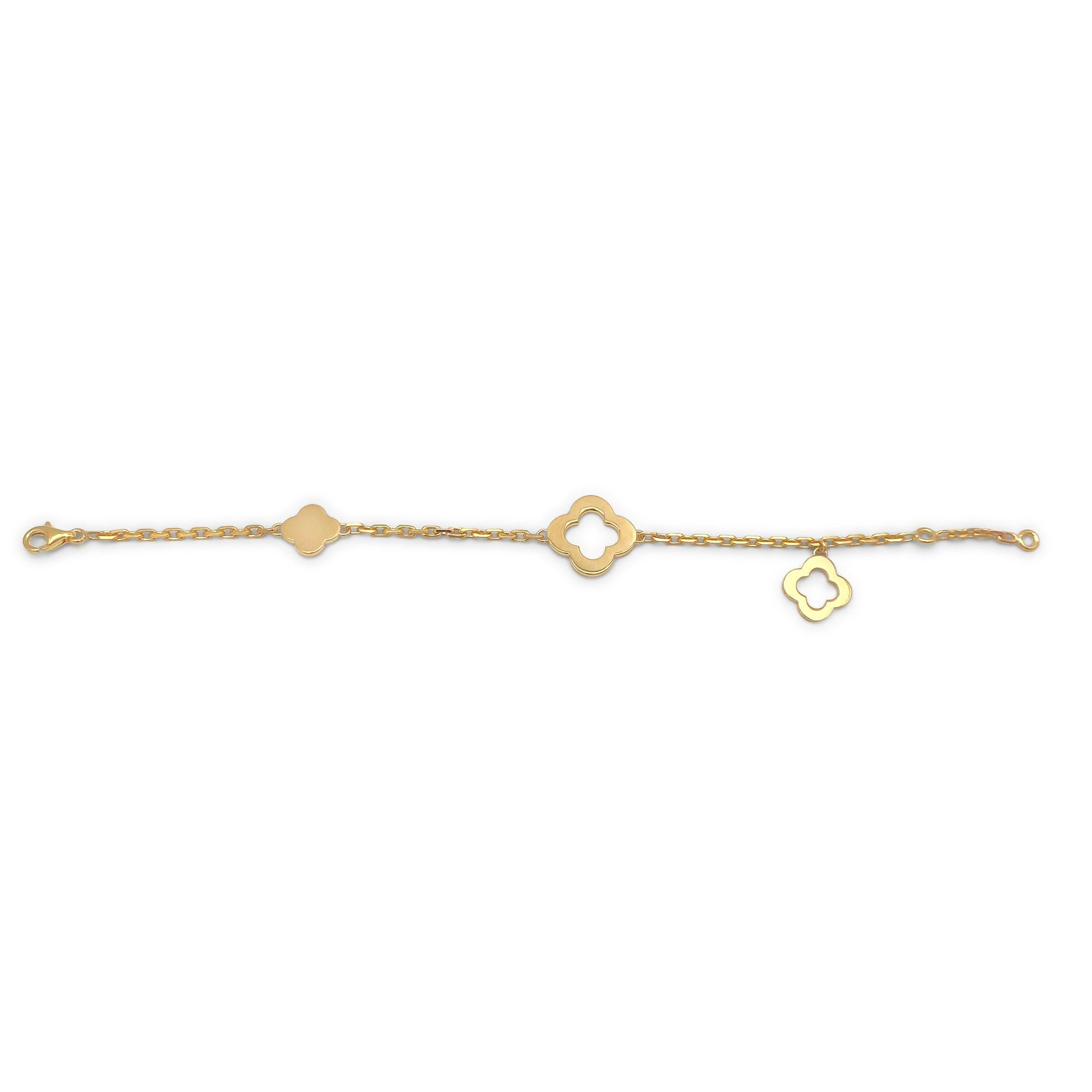 Authentic Van Cleef & Arpels Byzantine Alhambra bracelet crafted in 18 karat yellow gold.  The bracelet features a combination of solid and openwork motifs of varying sizes and measures 7 1/4 inches in length.  Signed VCA, Au750, with serial number