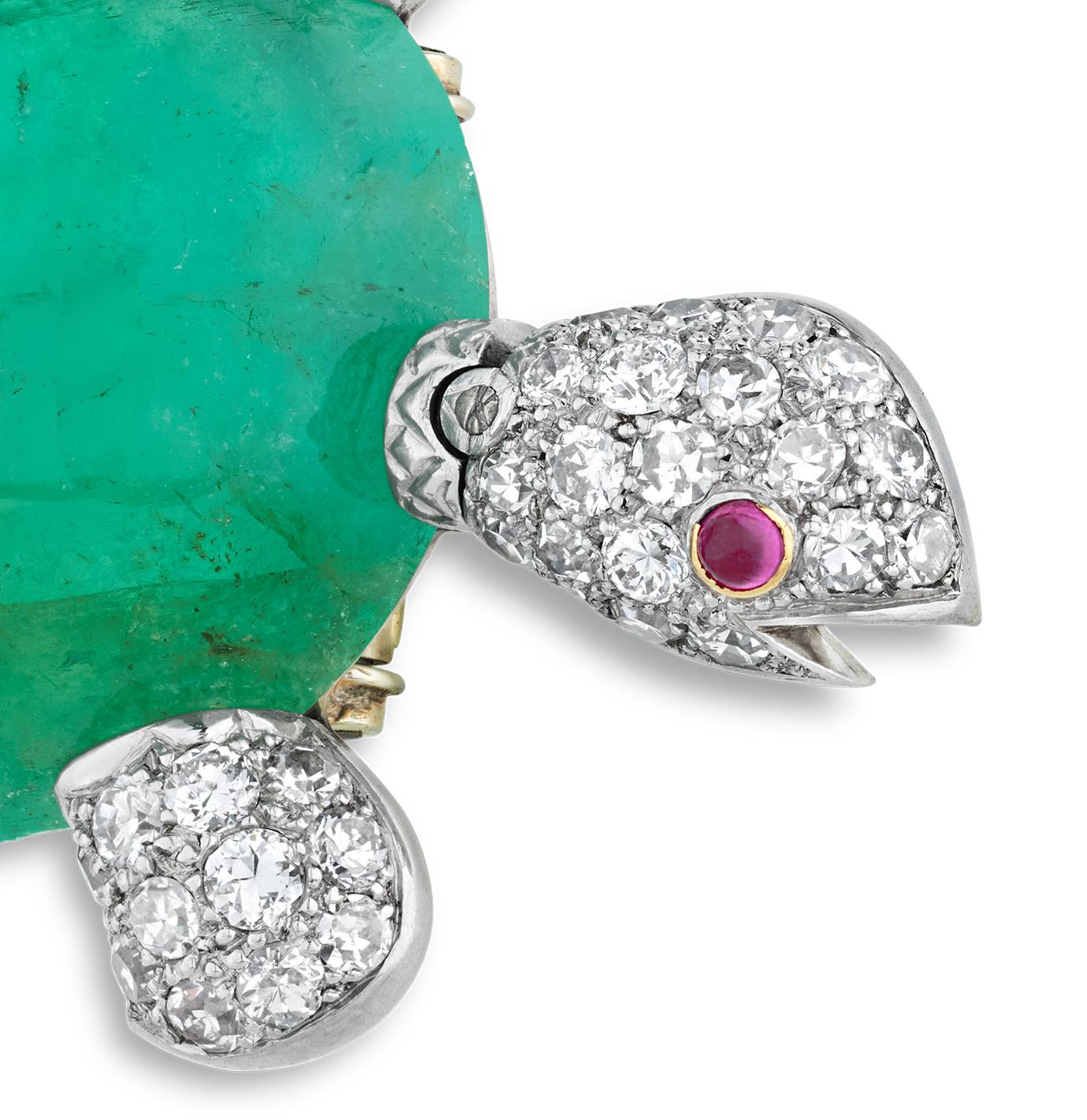 This extraordinary turtle pin by Van Cleef & Arpels showcases the house’s signature blend of whimsical design and expert craftsmanship. At its center is a striking oval cabochon emerald, weighing an astonishing 63.64 carats, whose deep green hue
