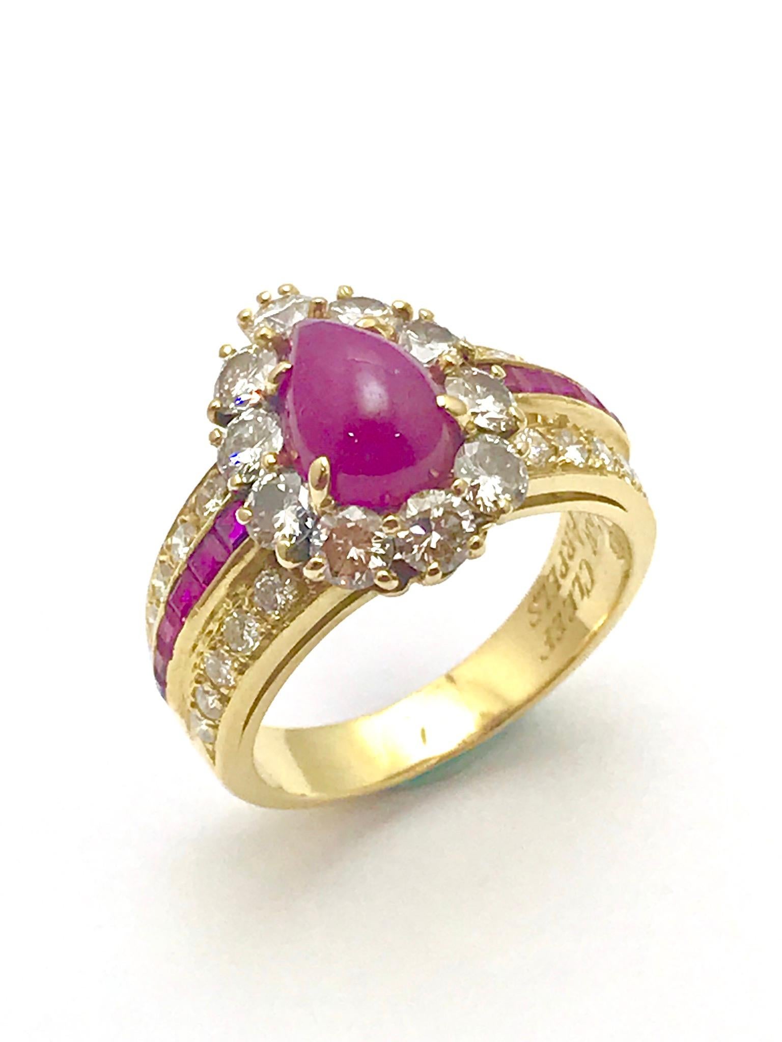 A Van Cleef & Arpels pear shape cabochon ruby and diamond 18 karat yellow gold ring.  The cabochon ruby is prong set and surrounded by ten round brilliant diamonds, atop a three row half shank containing two rows of diamonds and a row of rubies. 