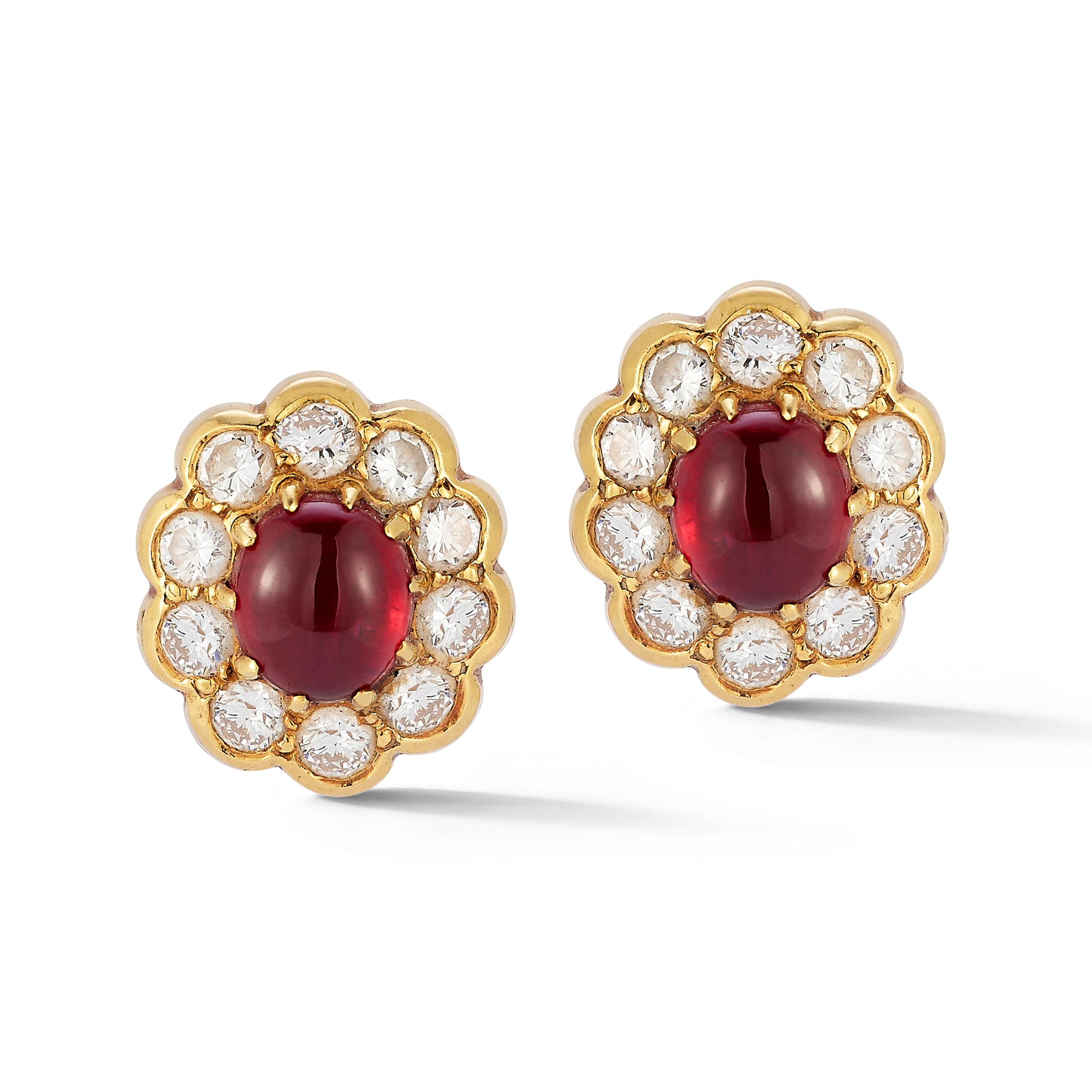 Van Cleef & Arpels Cabochon Ruby & Diamond Earrings

 A pair of earrings consisting of 1 center cabochon ruby surrounded by round cut diamonds forming a flower motif.

Measurements: .44