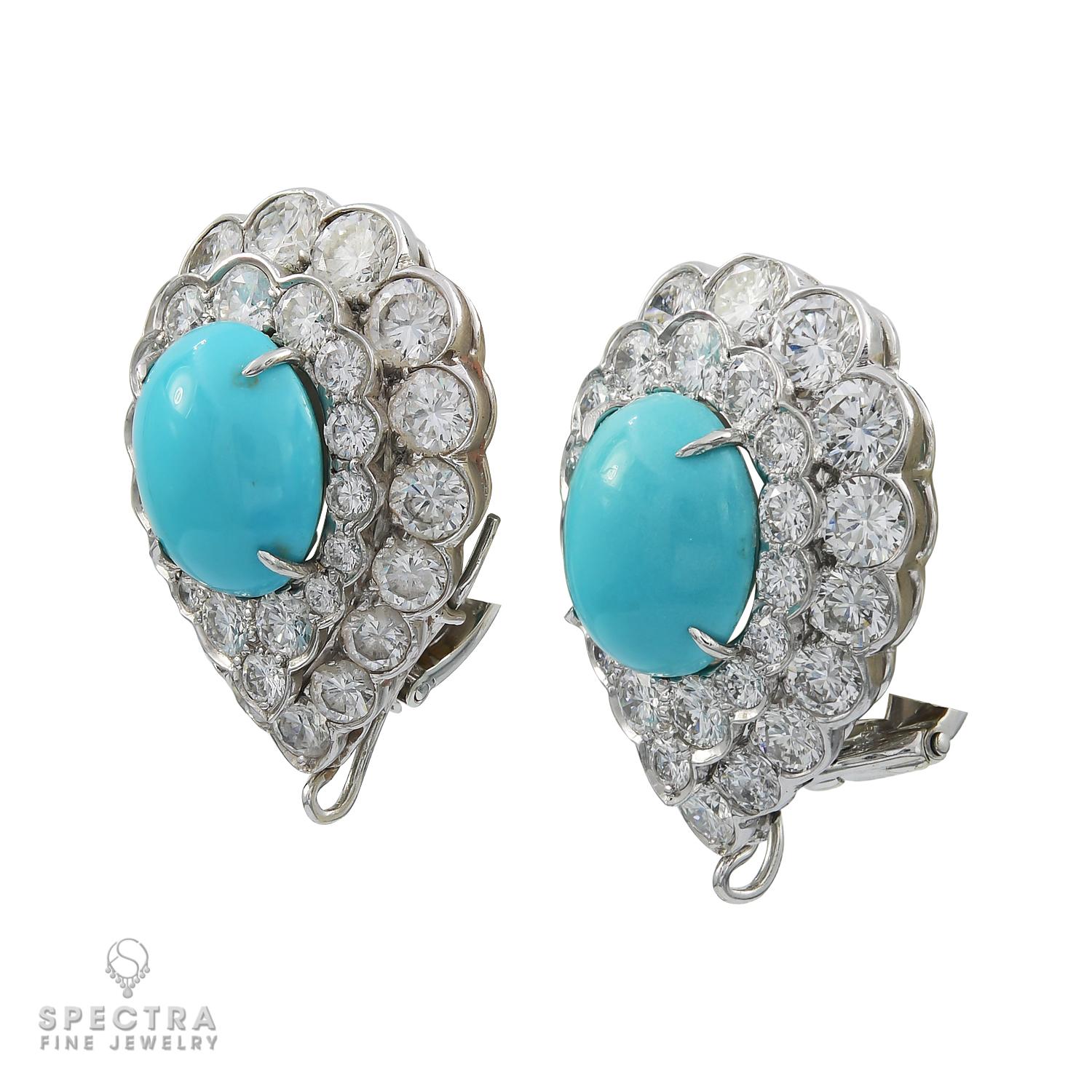 Beautiful ear clips, each set with a cabochon turquoise within a two-row circular-cut diamond surround, with a 
pendant hook for suspension. Created by the amazing House of Van Cleef & Arpels in France.
Mounted in platinum weighing 16.74