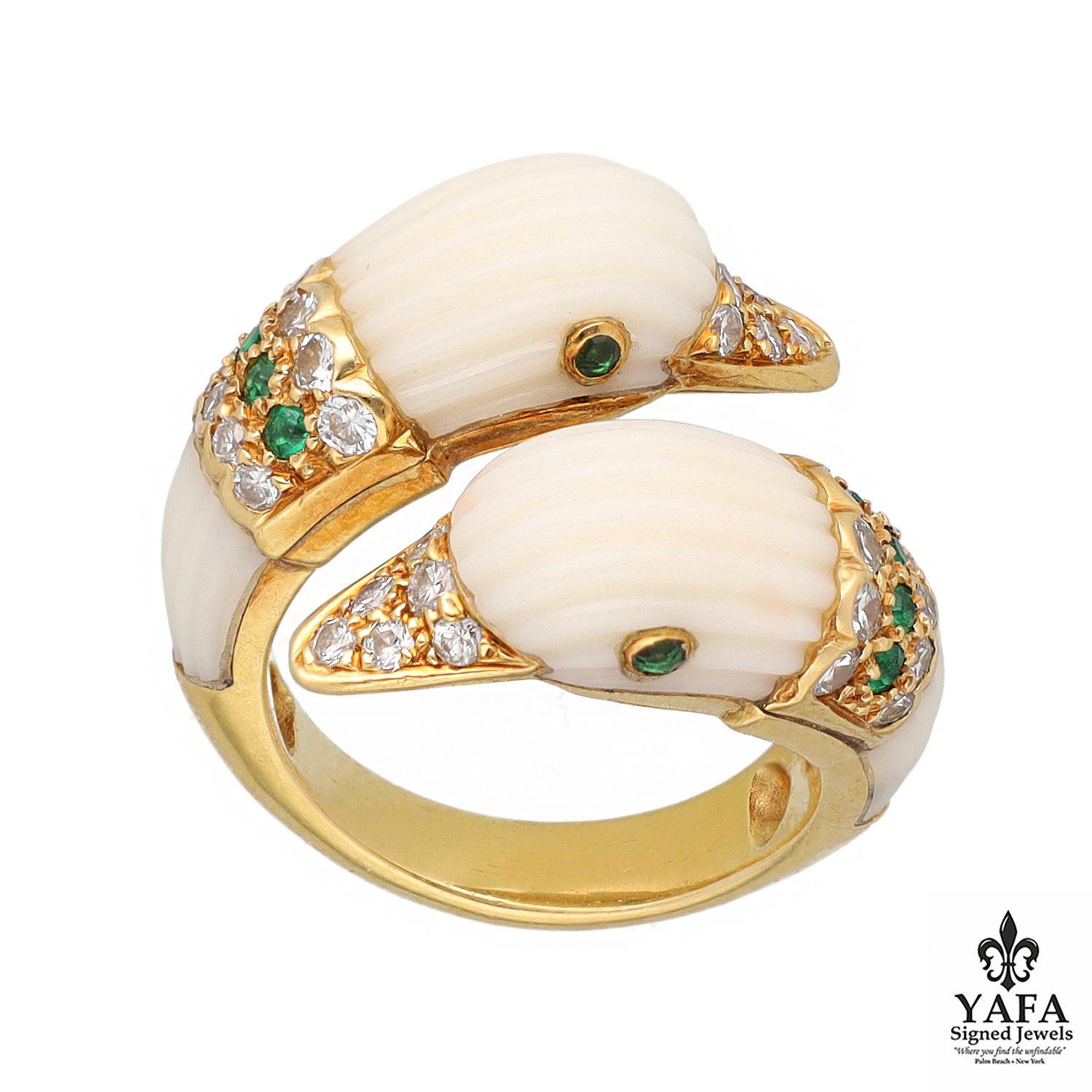 Designed By a Bypass Ring of Stylized Double Head Fluted White Coral Duck Heads, set with Circular-Cut Diamond Beak and Emerald Eyes Accented with Diamond and Emerald Set Collars, Mounted in 18K Yellow Gold. Original Design Copyright by Van Cleef &