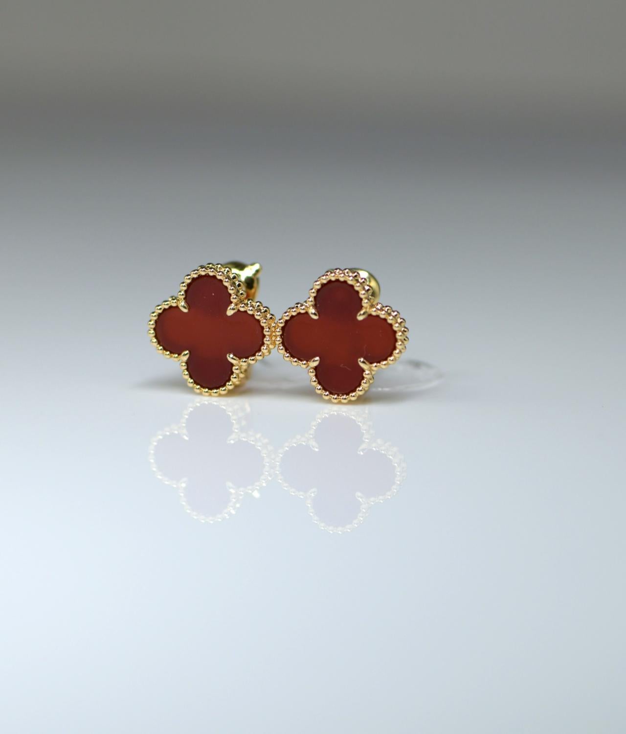 Classic Van Cleef & Arpels carnelian Alhambra earrings. The carnelian is set in 18 karat yellow gold. It is in perfect condition. This piece at this price is something you should snap up while you can.

These are sure to become a staple of your