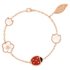 Van Cleef & Arpels, bracelet Lucky Spring à 5 motifs en or, cornaline et onyx MOP