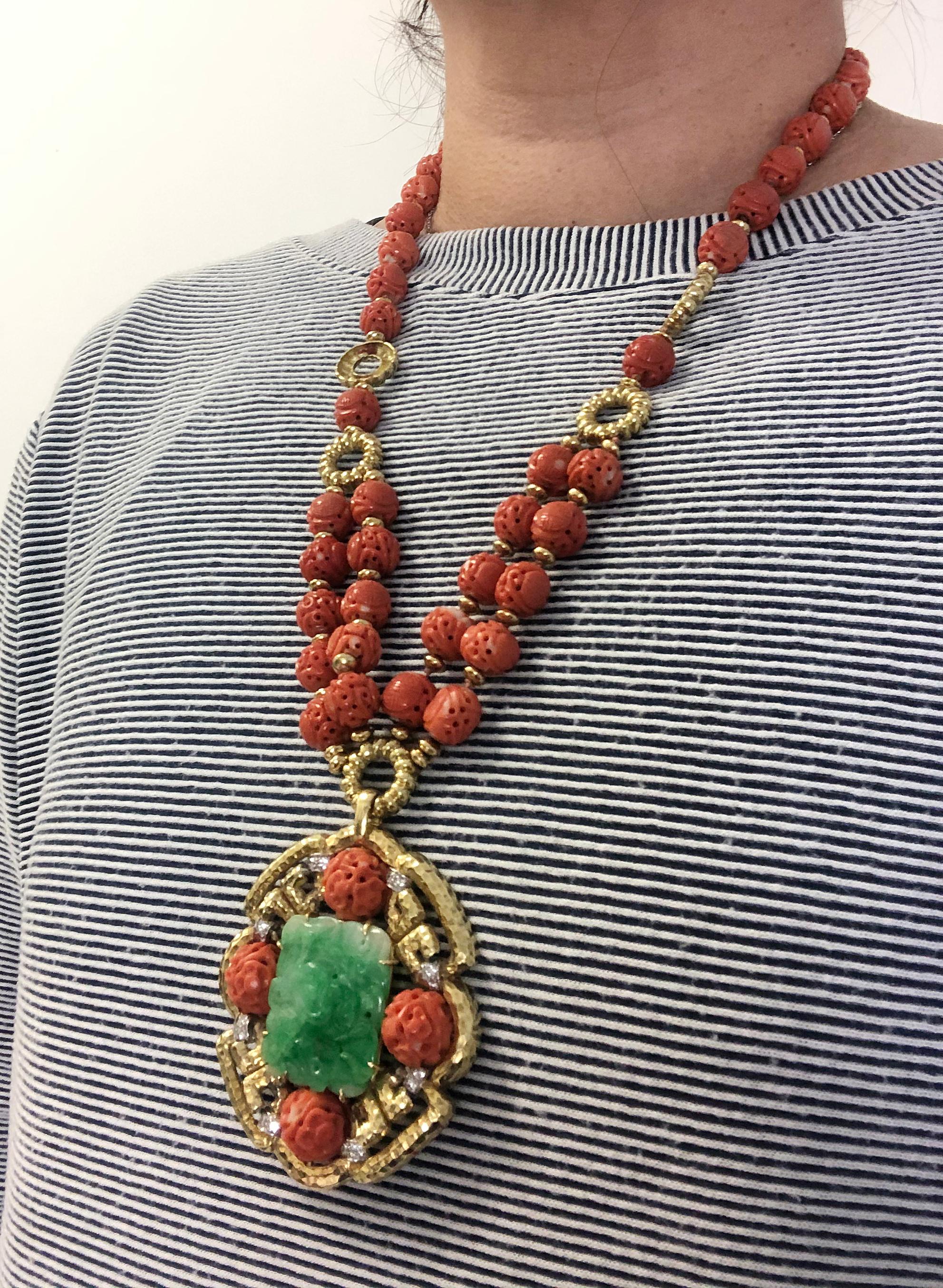 VAN CLEEF & ARPELS Carved Coral Beads, Jade, Diamond Necklace

18k yellow gold pendant necklace, set with diamonds, carved coral beads, and jade, signed Van Cleef & Arpels.
Measures necklace approx. 26″ in total length and pendant 2.75″ in length by