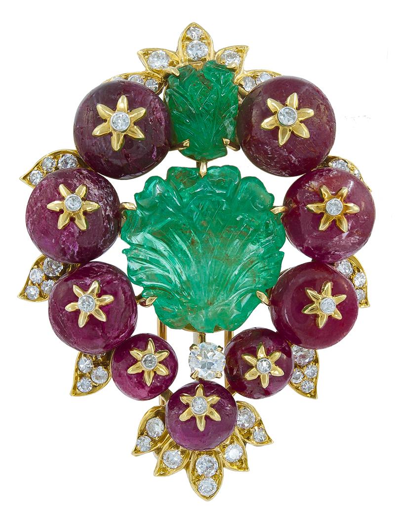 Van Cleef & Arpels Carved Emerald Ruby Convertible Suite in 18k Yellow Gold with Diamonds.

The suite includes a number of pieces: A necklace that detaches and converts into two separate bracelets as well as a brooch. Materials include hand-carved