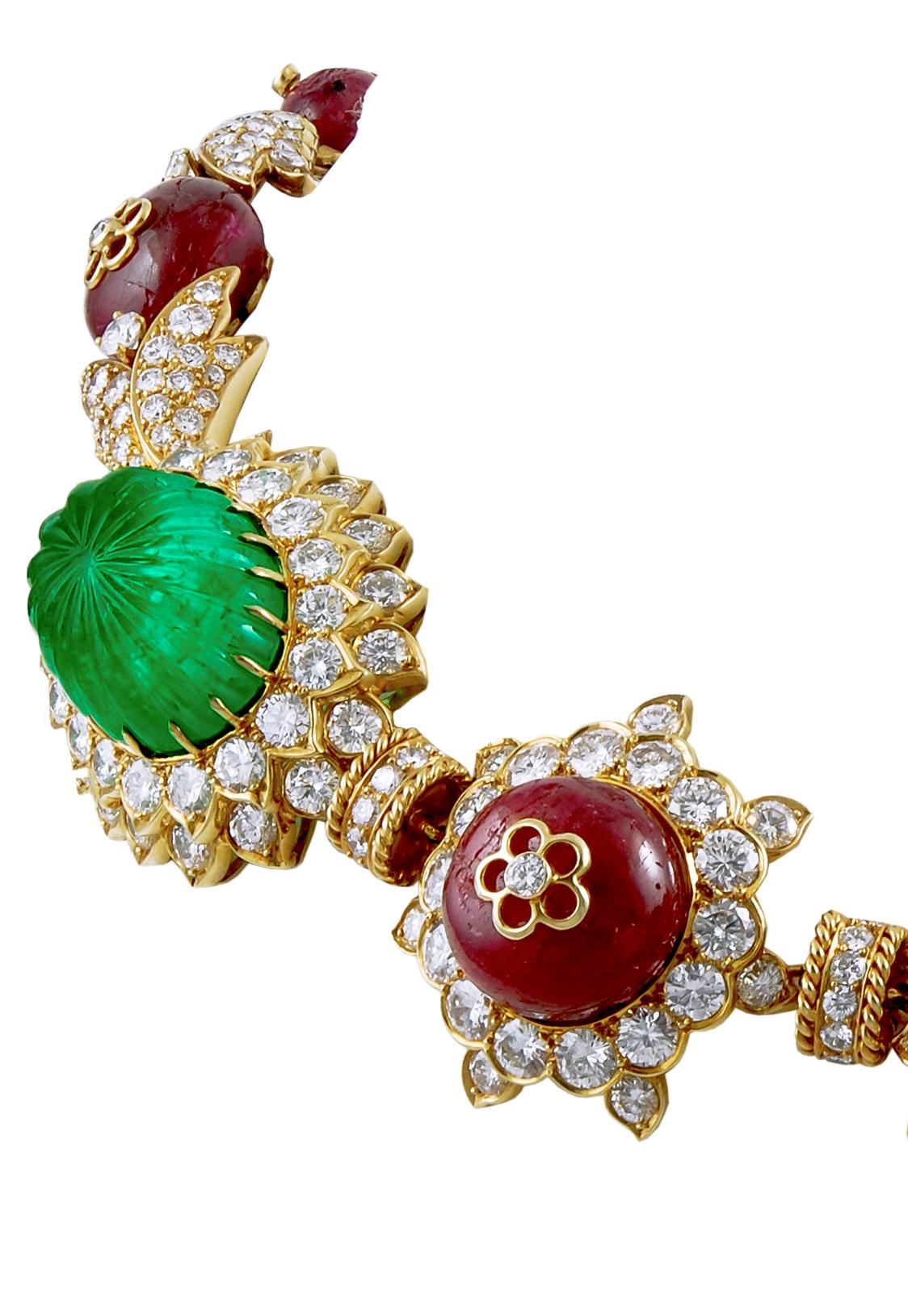 VAN CLEEF & ARPELS Carved Emerald, Ruby, Diamond Necklace-Bracelet Combination

Of Indian inspiration, set at the front with three carved emerald cabochons and four larger ruby beads, the backset with four carved emerald beads alternating with seven