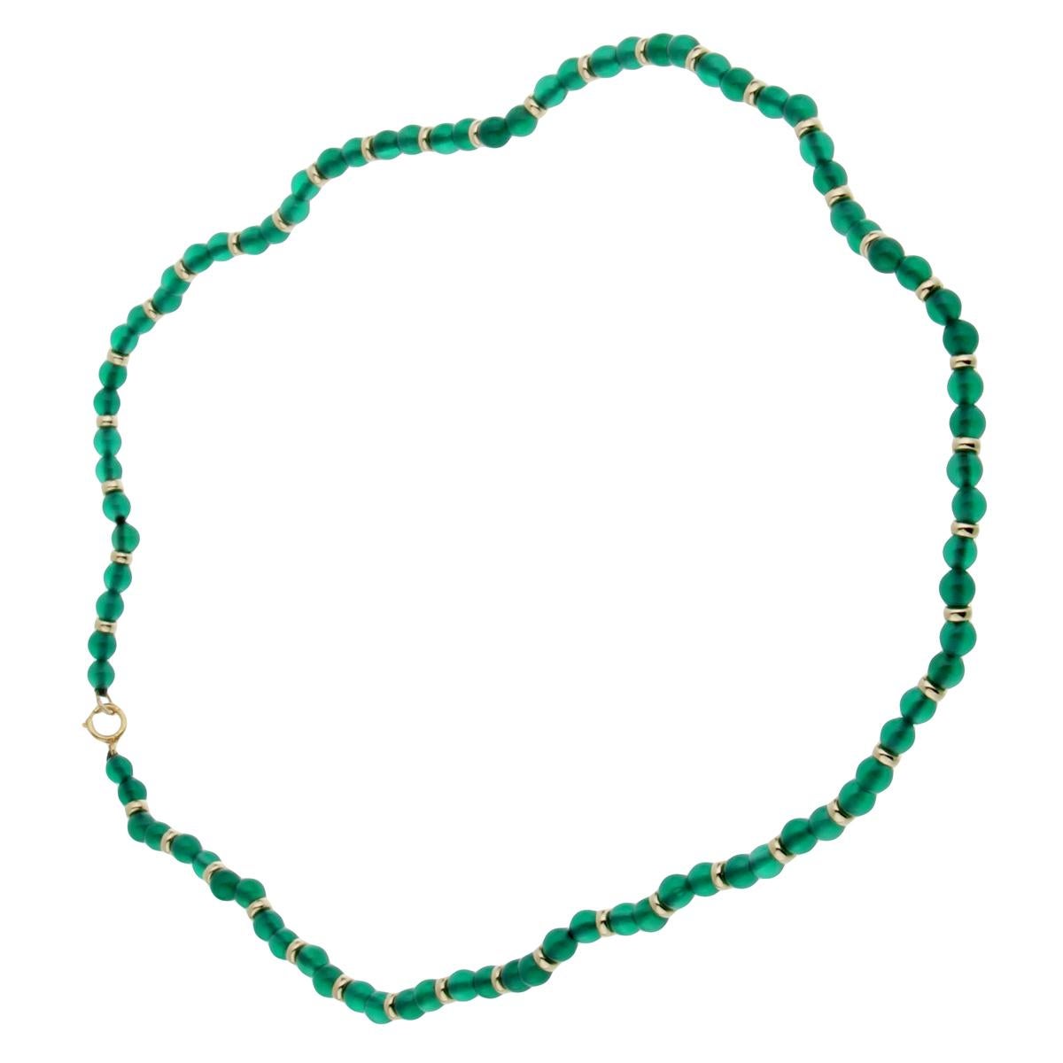 Van Cleef & Arpels showcasing 4mm beaded chrysophase seperated by 18k yellow gold. The necklace measures 16