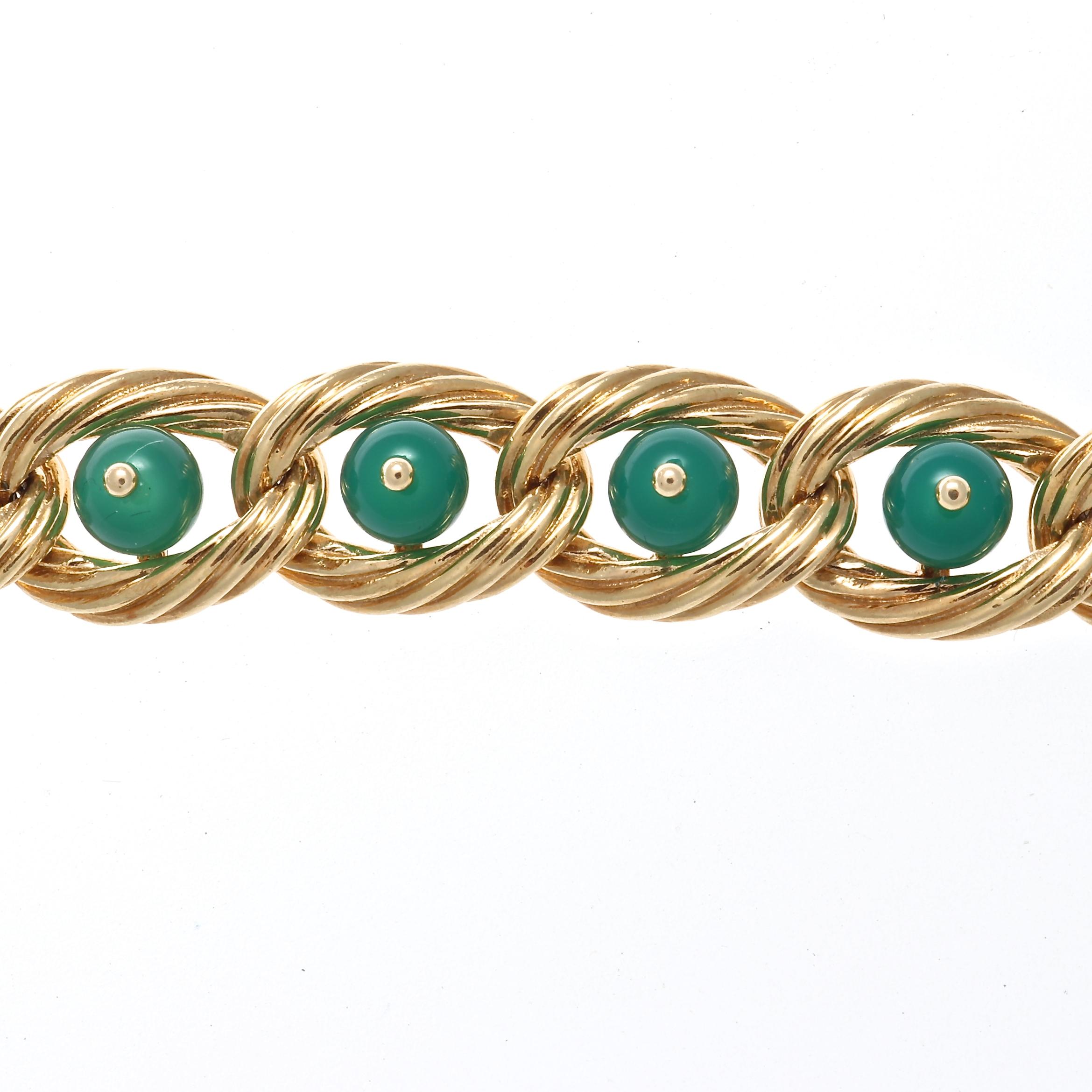 Iconic vintage creation from  Van Cleef & Arpels. Featuring etched gold wrapping seamlessly around the forest green chrysoprase. Signed Van Cleef & Arpels, numbered and stamped with French hallmarks. Please contact us if you are interested in buying