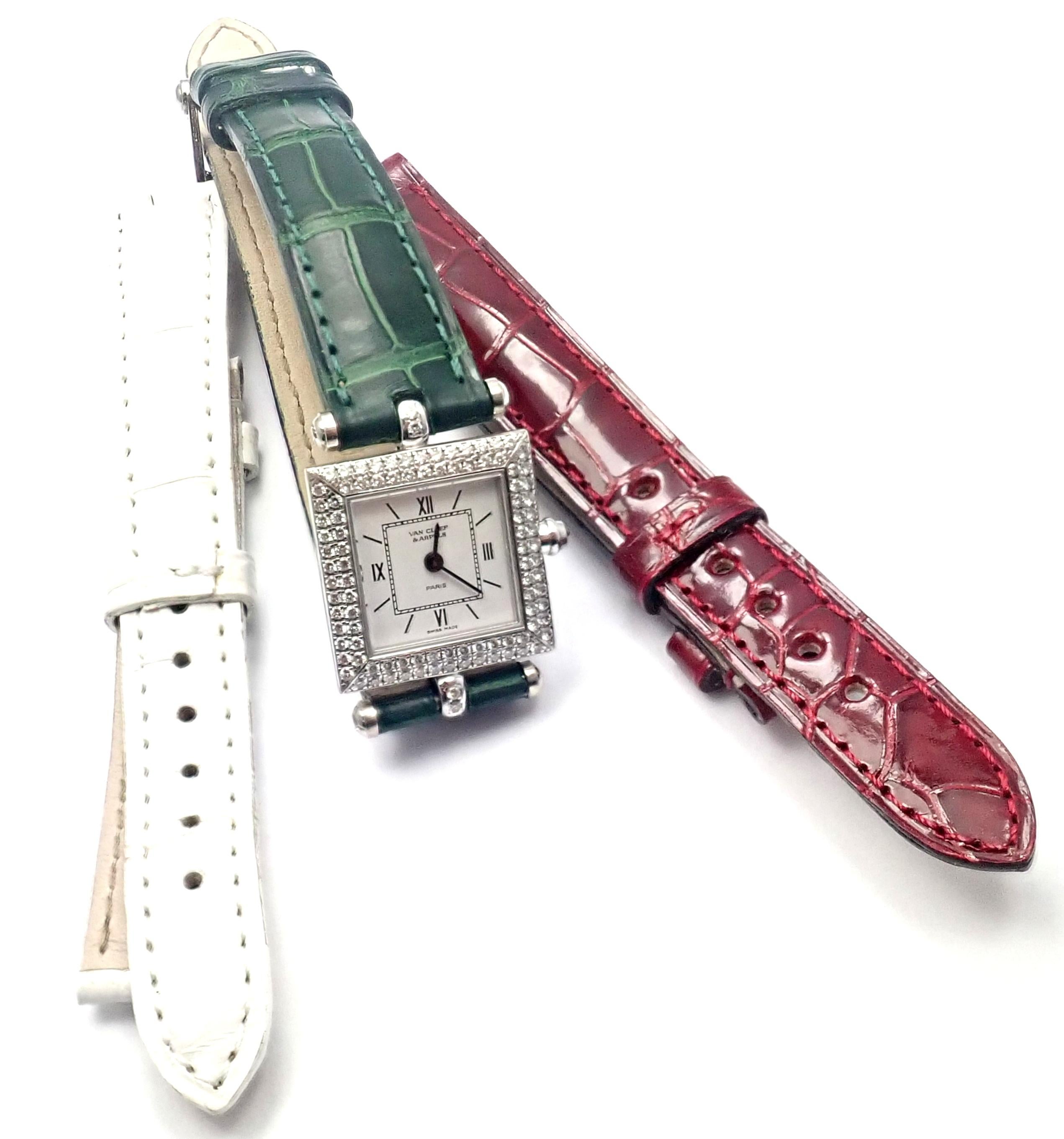18k White Gold Diamond Classique Watch With Two Aadditional Leather Bands (red and white) Wristwatch by Van Cleef & Arpels.
With round brilliant cut diamonds VVS1 clarity, E color in bezel and lugs total weight approx. 1.05ct
1 Diamond in the