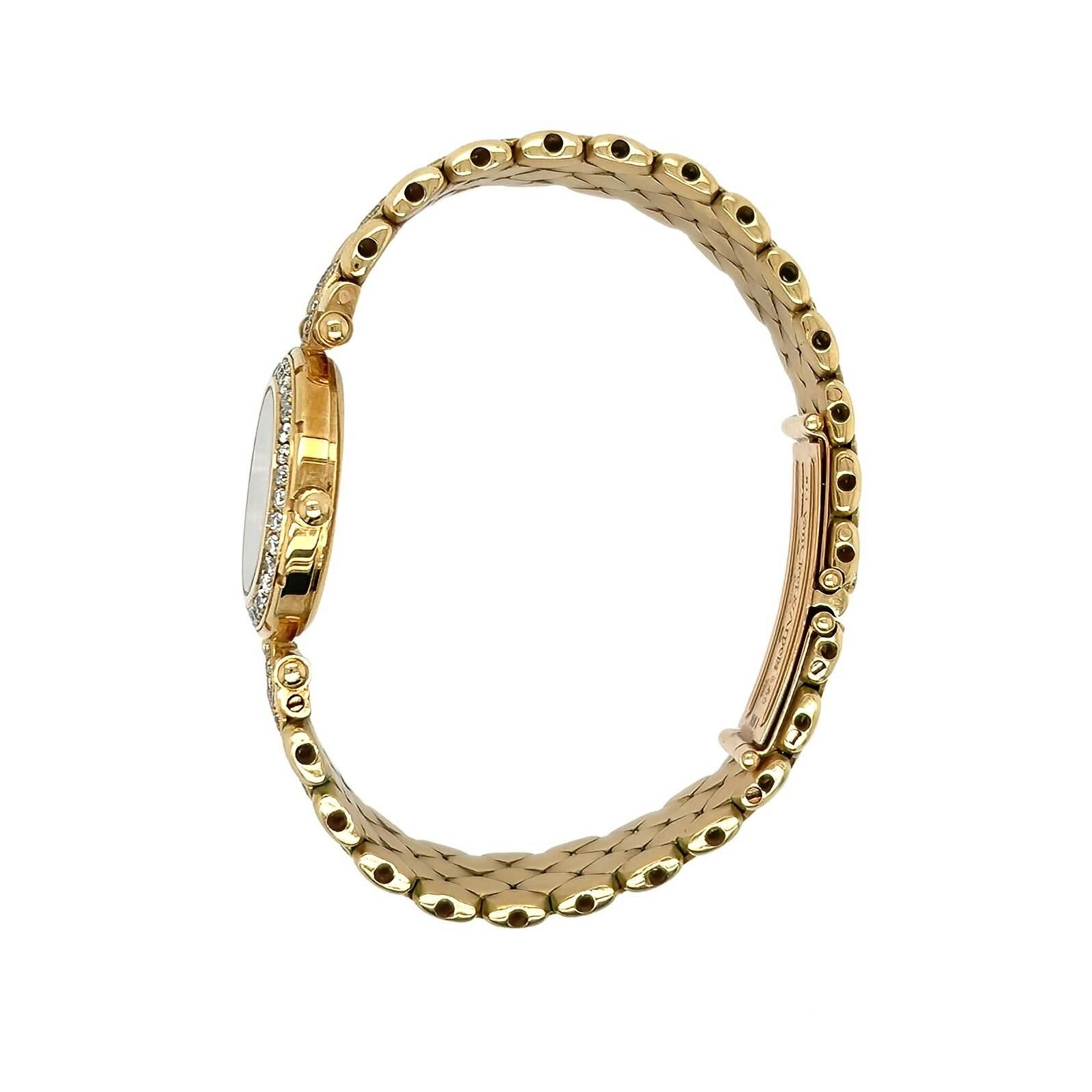 An 18 karat yellow gold and diamond watch, Van Cleef & Arpels.  The 