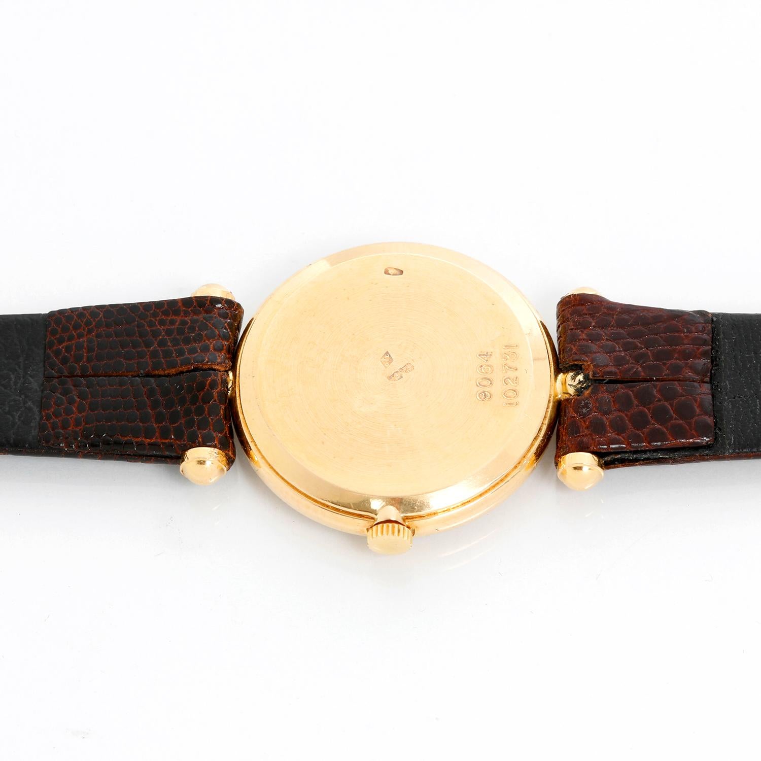 Van Cleef & Arpels Classique Watch - Manual . 18K Yellow gold case with smooth bezel; 24mm. White dial with Roman Numeral hour markers. Brown Crocodile strap with  tang buckle.. Pre-owned with custom box. 