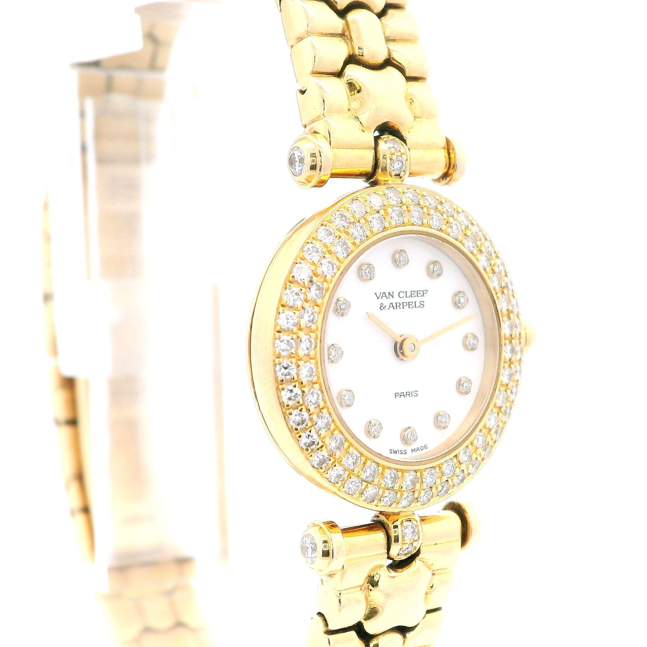 Experience the exquisite craftsmanship of Van Cleef & Arpels with this elegant timepiece, a testament to 21st-century luxury.

This watch, crafted in 18K yellow gold, features a round face adorned with approximately 0.53 carats of white diamonds.