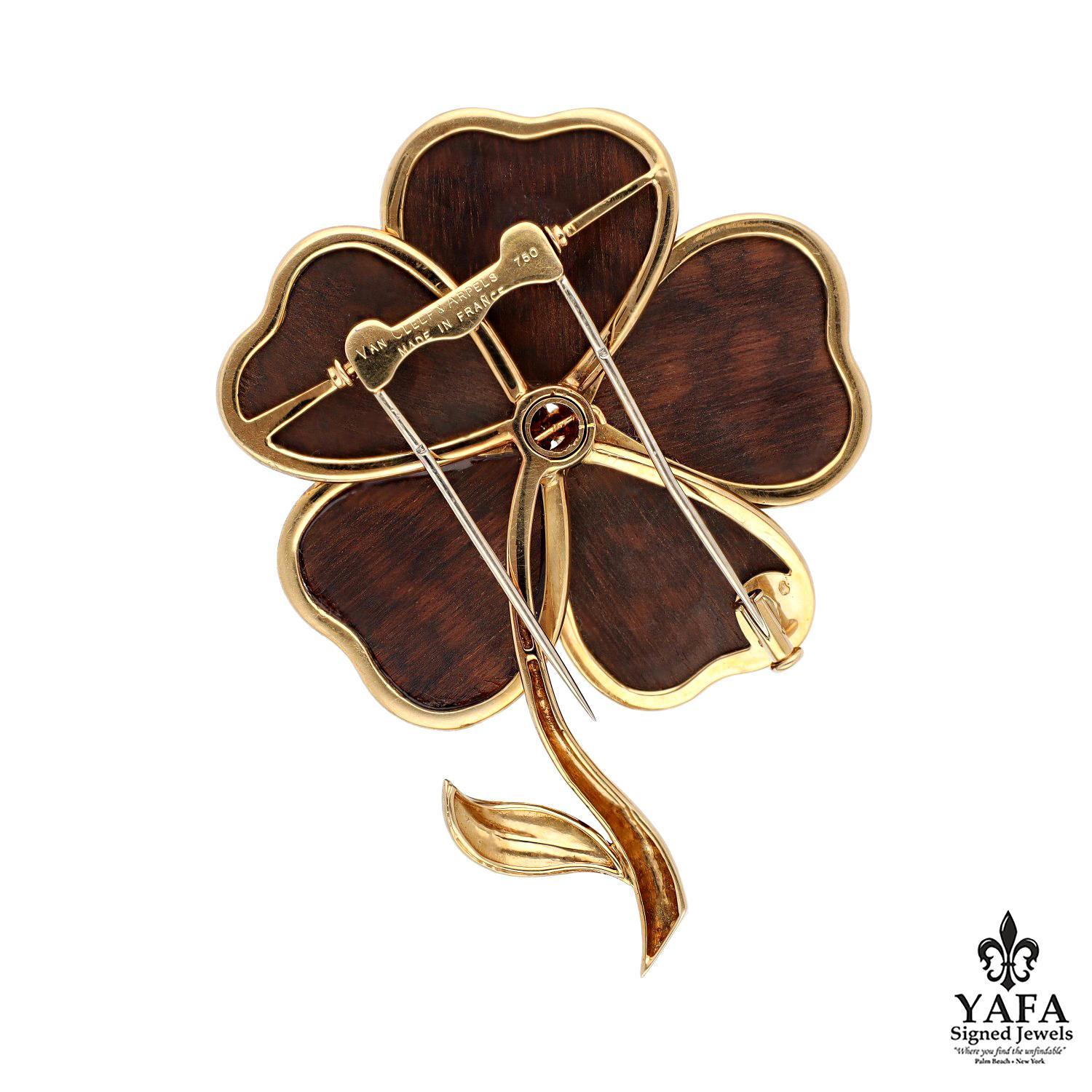 18K Yellow Gold, Framed Wood Petals Accented by 3 Round Gold Beads Set a top a Flare Design. 

Circa - 1980's
Approximate Length - 3
