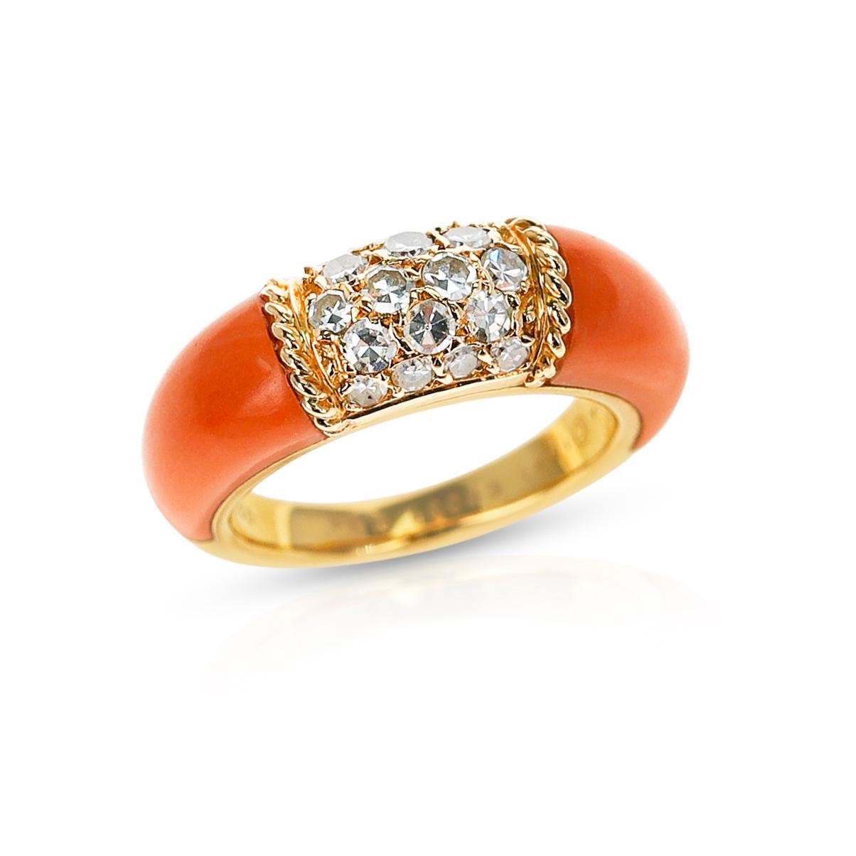 A Van Cleef & Arpels Ring with Two Carved Coral Inlays and 5 Row Diamond Stacking Philippine Ring made in 18K Yellow Gold.  The total weight is 7.20 grams.