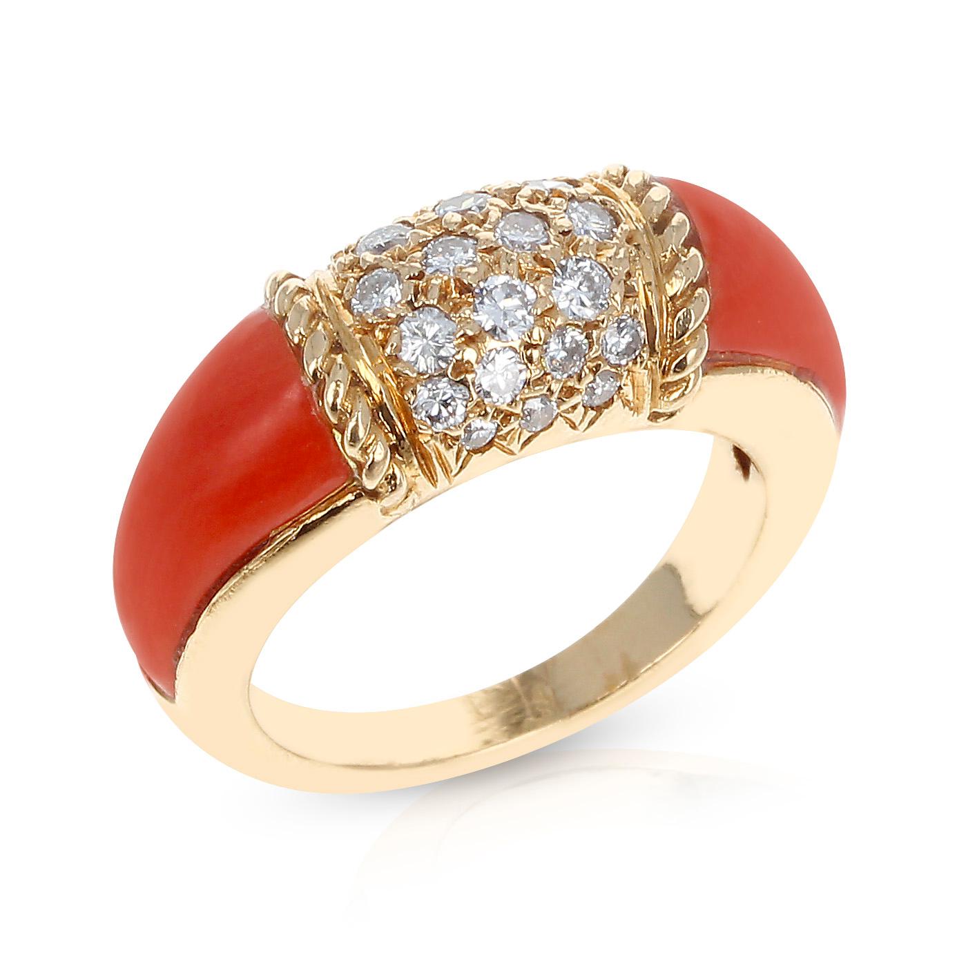 A Van Cleef & Arpels Ring with Two Carved Coral Inlays and 7 Row Diamond Stacking Philippine Ring made in 18K Yellow Gold. There are 7 rows of diamonds, totaling to 24 round diamonds, and it is common to see these with 5 rows and 18 diamonds total,