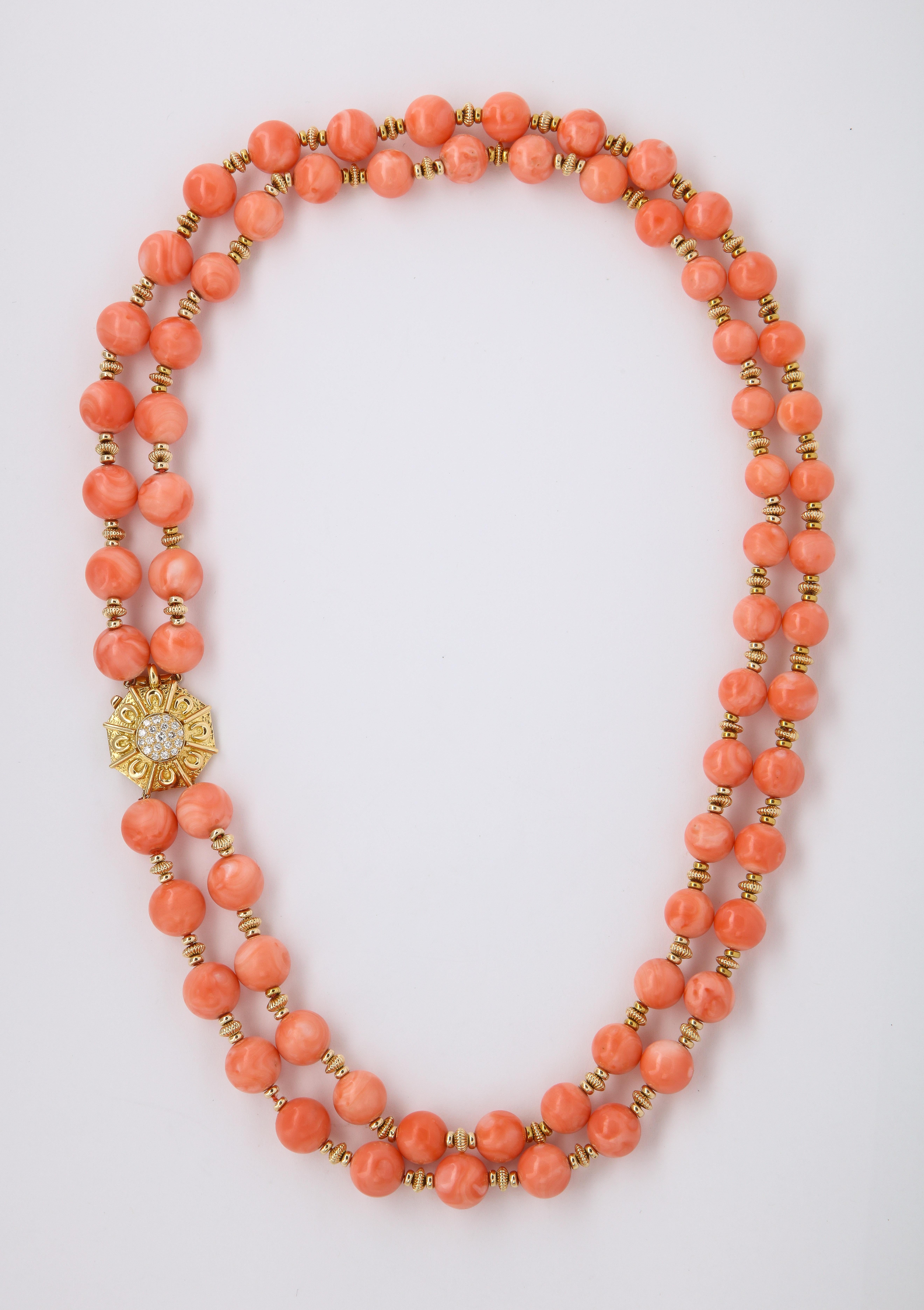 Van Cleef & Arpels Coral Bead Necklace, double strands of beads with 18K Yellow Gold spacers  & diamonds set at the clasp
68  beads  approx 8.80 mm to 11.50 mm
19 round cut diamonds
Diamond Weight: approx 0.40 - 0.50 Cts 
Signed VCA , Marked made in