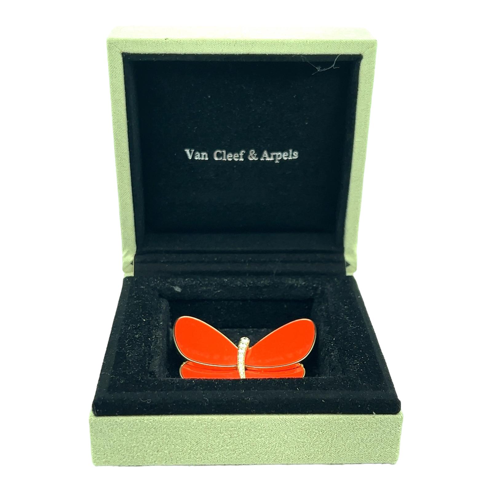 Van Cleef & Arpels popular coral and diamond butterfly clip brooch crafted in 18 karat yellow and white gold. The coral butterfly features 9 round brilliant cut diamonds weighing approximately .30 CTW and graded DE color and VVS clarity. The