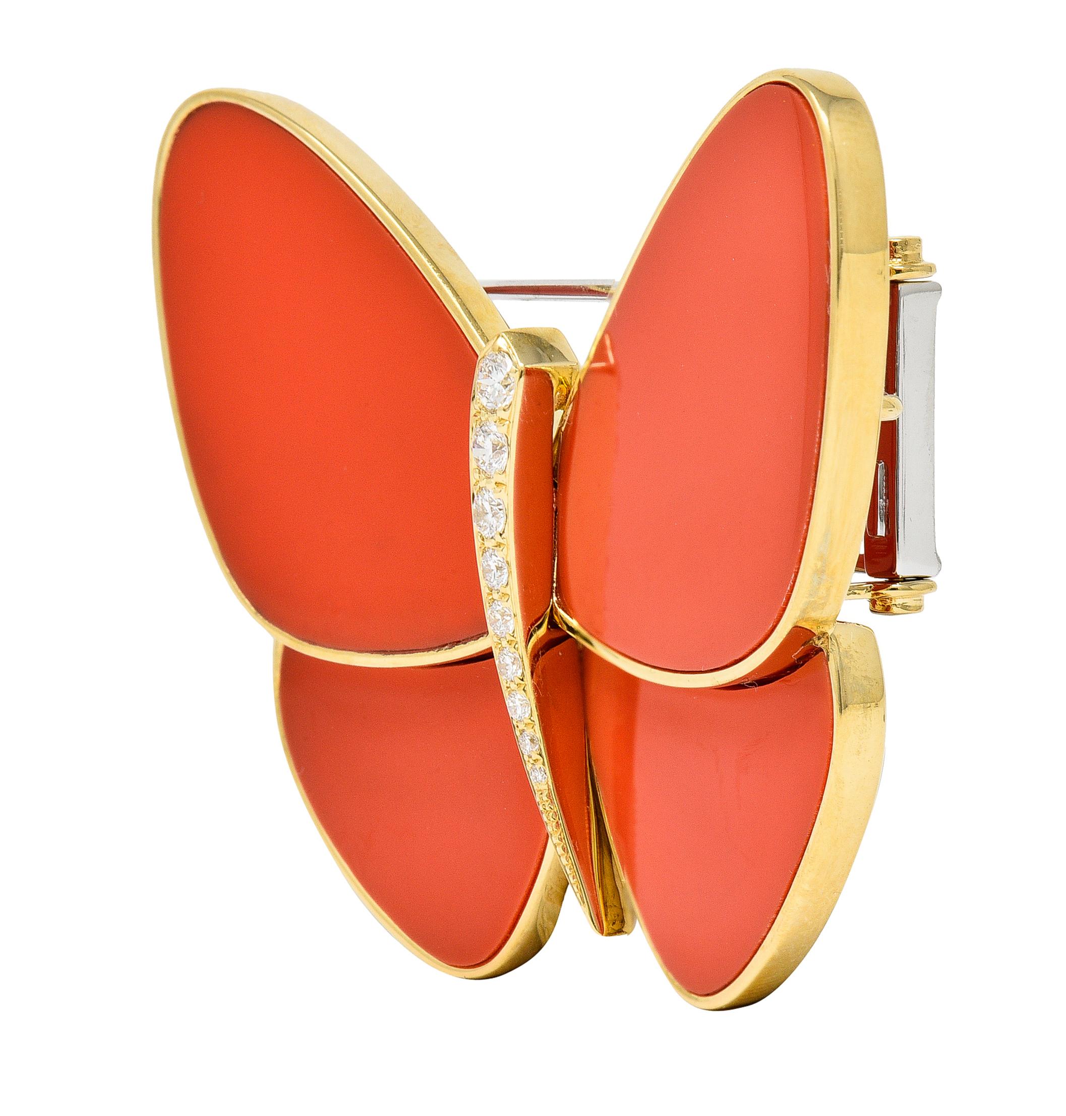 Designed a stylized butterfly featuring inlaid coral wings 
Opaque medium reddish-orange in color
Centering round brilliant cut diamonds 
Bead set in body and graduating in size
Weighing approximately 0.38 carat total
G/H color with VS clarity