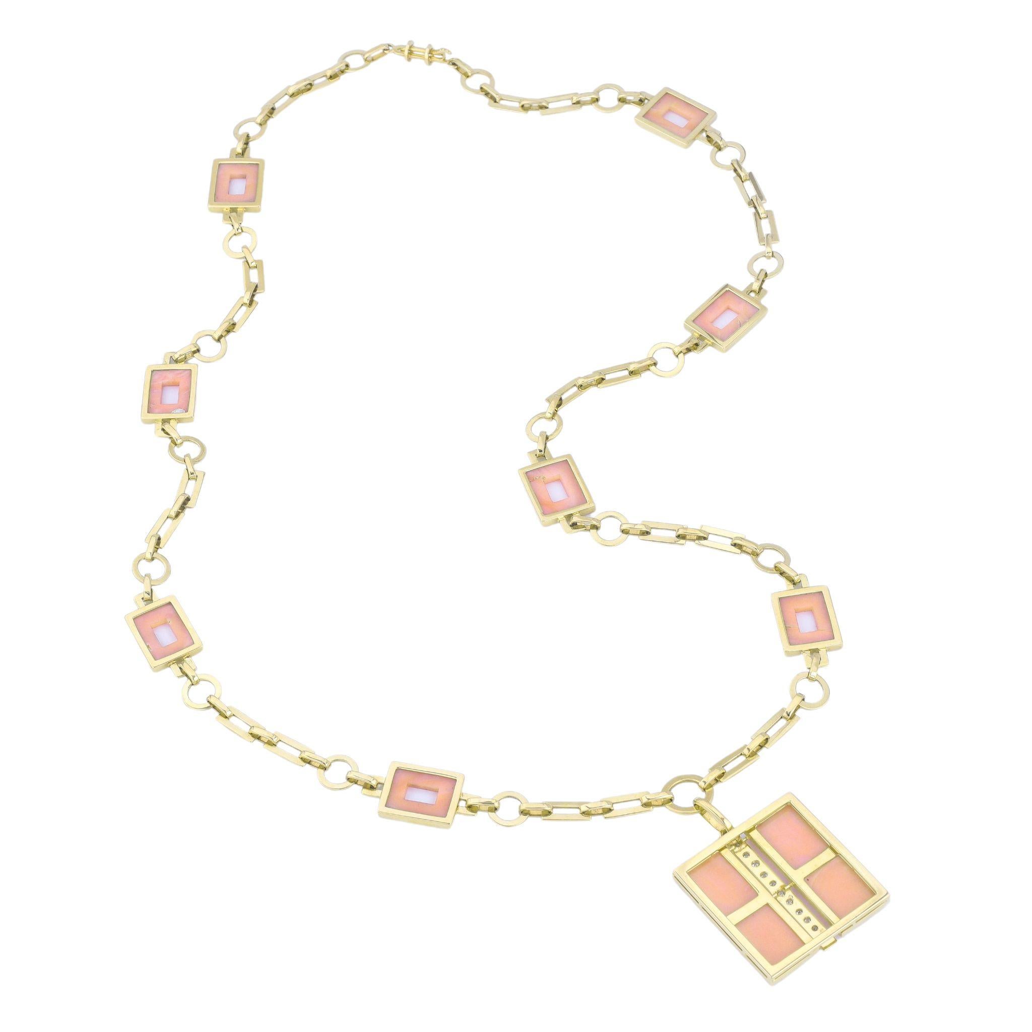 An elegant and striking necklace by Van Cleef & Arpels, crafted in 18k yellow gold and featuring rectangular coral inlays accented by diamonds. The necklace showcases a symmetrical design of open-link chains, punctuated by coral squares framed in