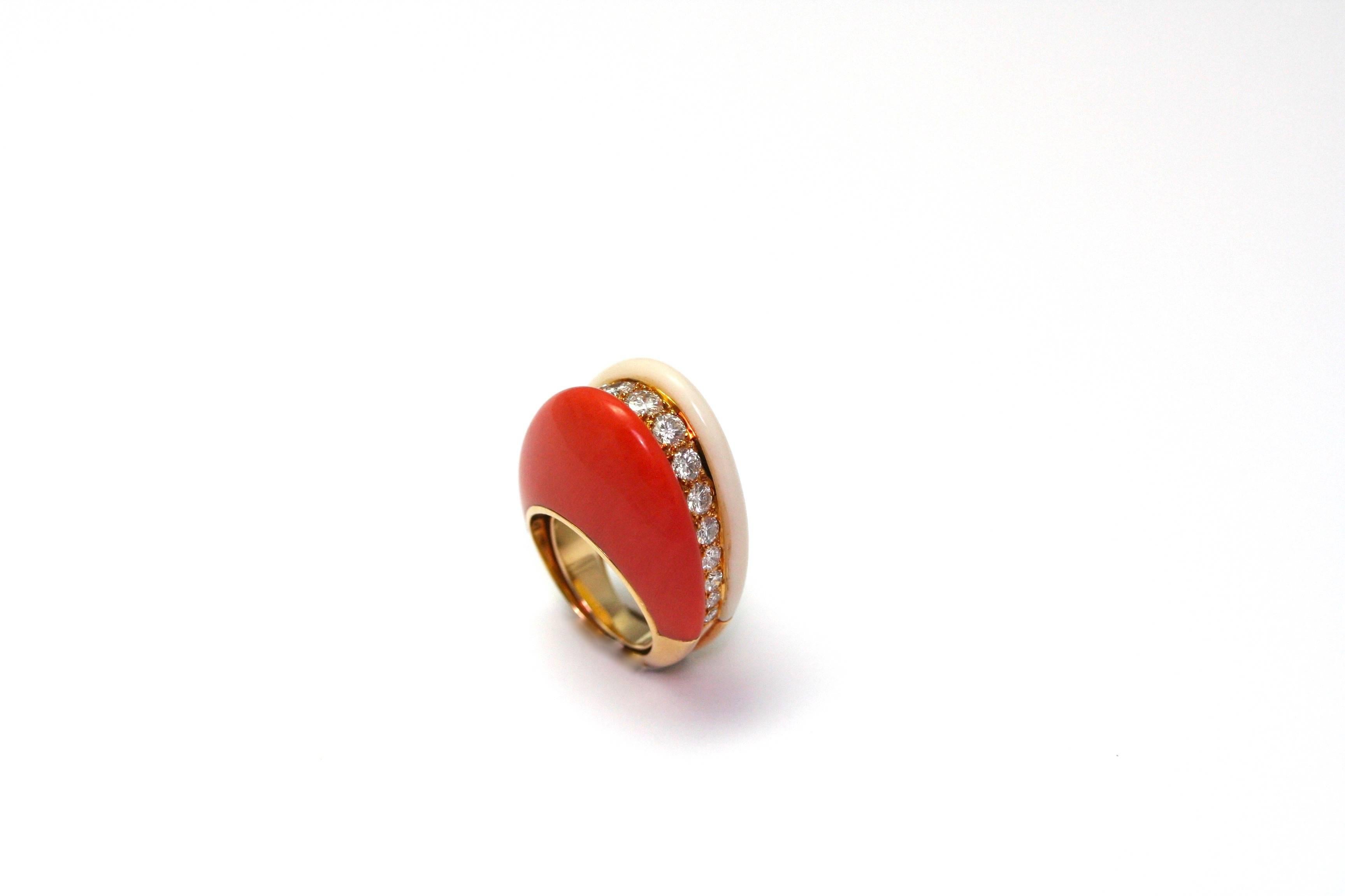 Van Cleef & Arpels half set composed with a ring and earrings in yellow gold, diamonds, white and red coral. Signed and numbered. 
(40,6 grs)
Dimensions : 
Ring : total height : 3cm, ring size 3 3/4 (large 46)
Earrings : height : 2.4 cm, lenght :