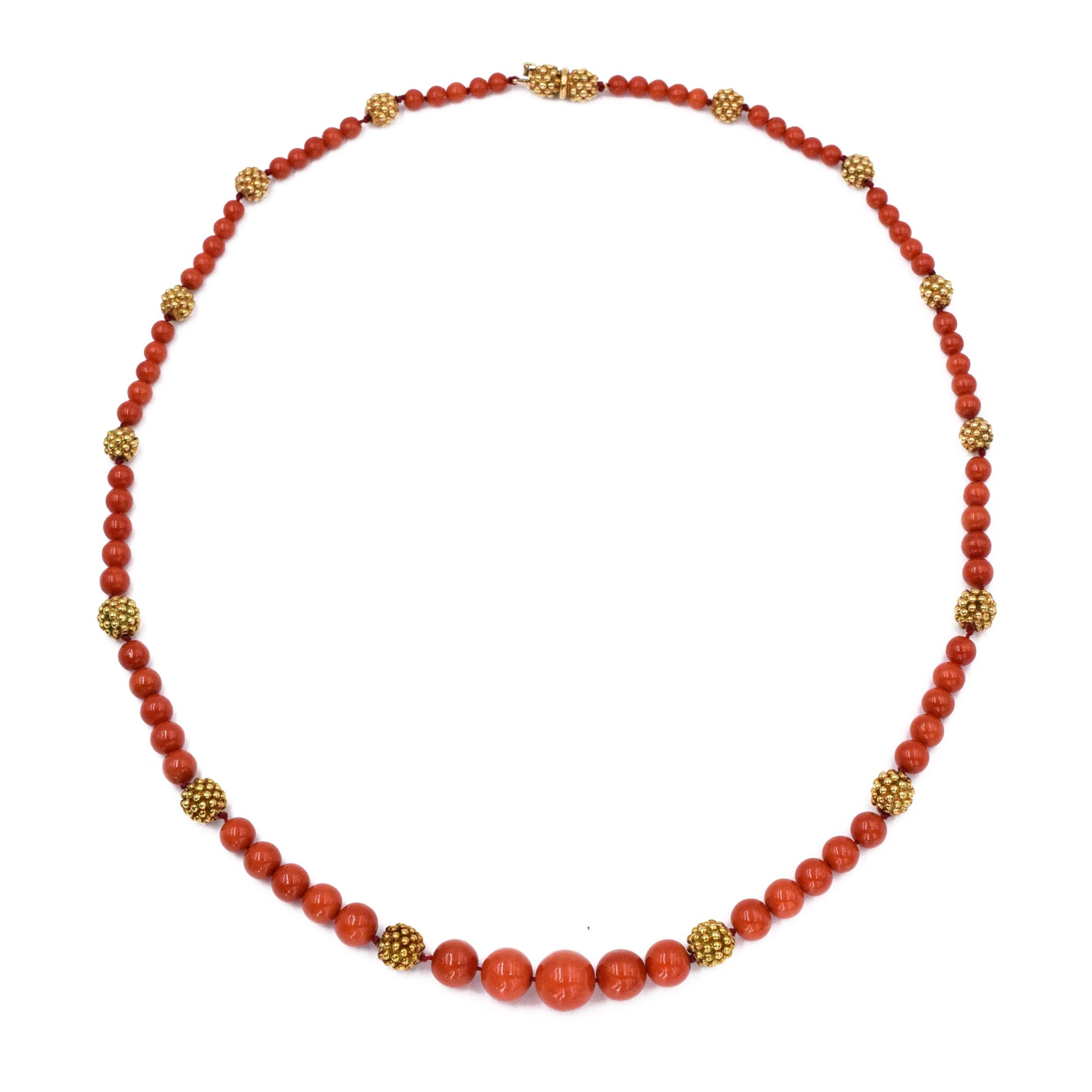  Van Cleef & Arpels composed of seventy-five coral beads, measuring approximately 11.9 to 4.6mm, interspersed with textured gold spheres
 Signed VCA NY, no XXXXXX
length: 24in.  18k gold 