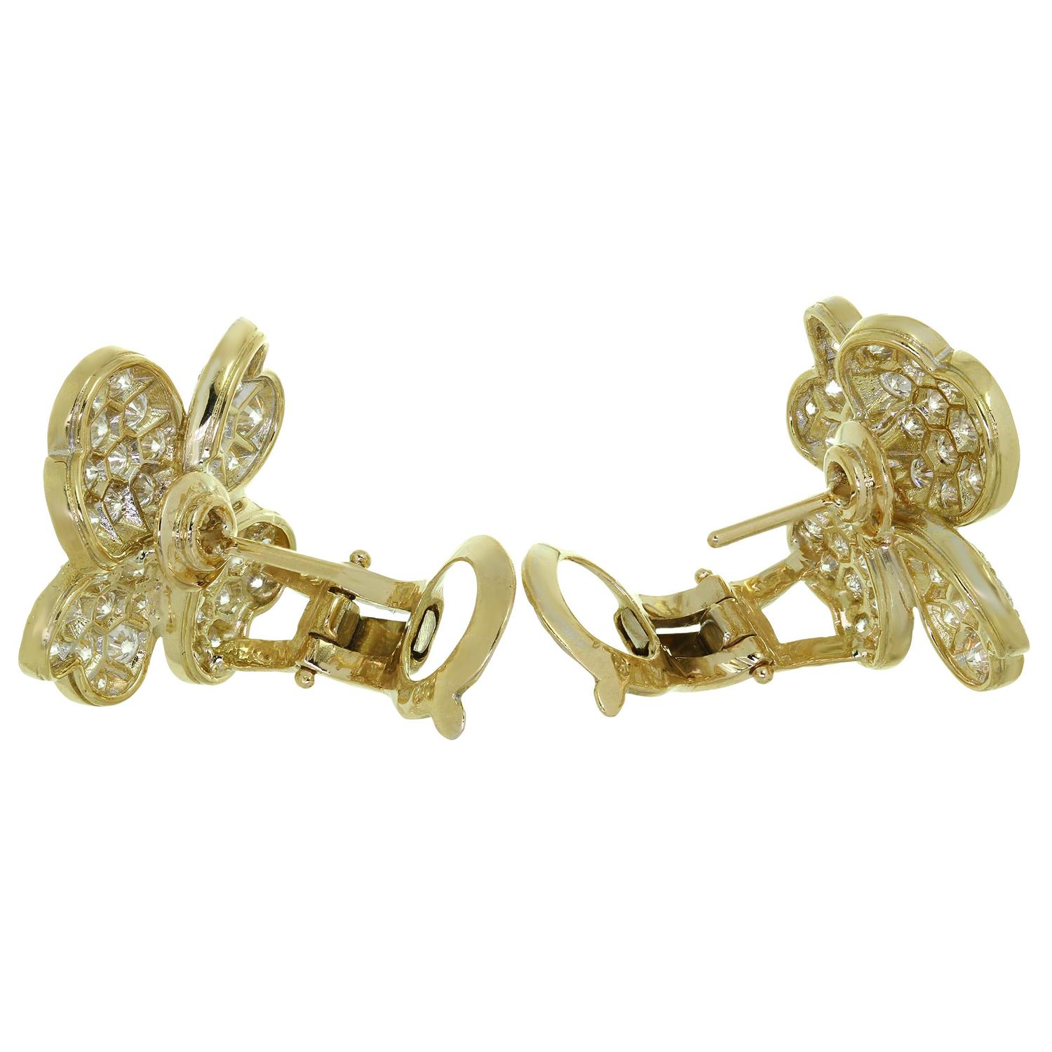 These rare Van Cleef & Arpels 4-petal flower earrings from the gorgeous Cosmos collection feature a flower design crafted in 18k yellow gold and set with round brilliant D-E-F VVS1-VVS2 diamonds weighing an estimated 3.0 carats. This is the medium