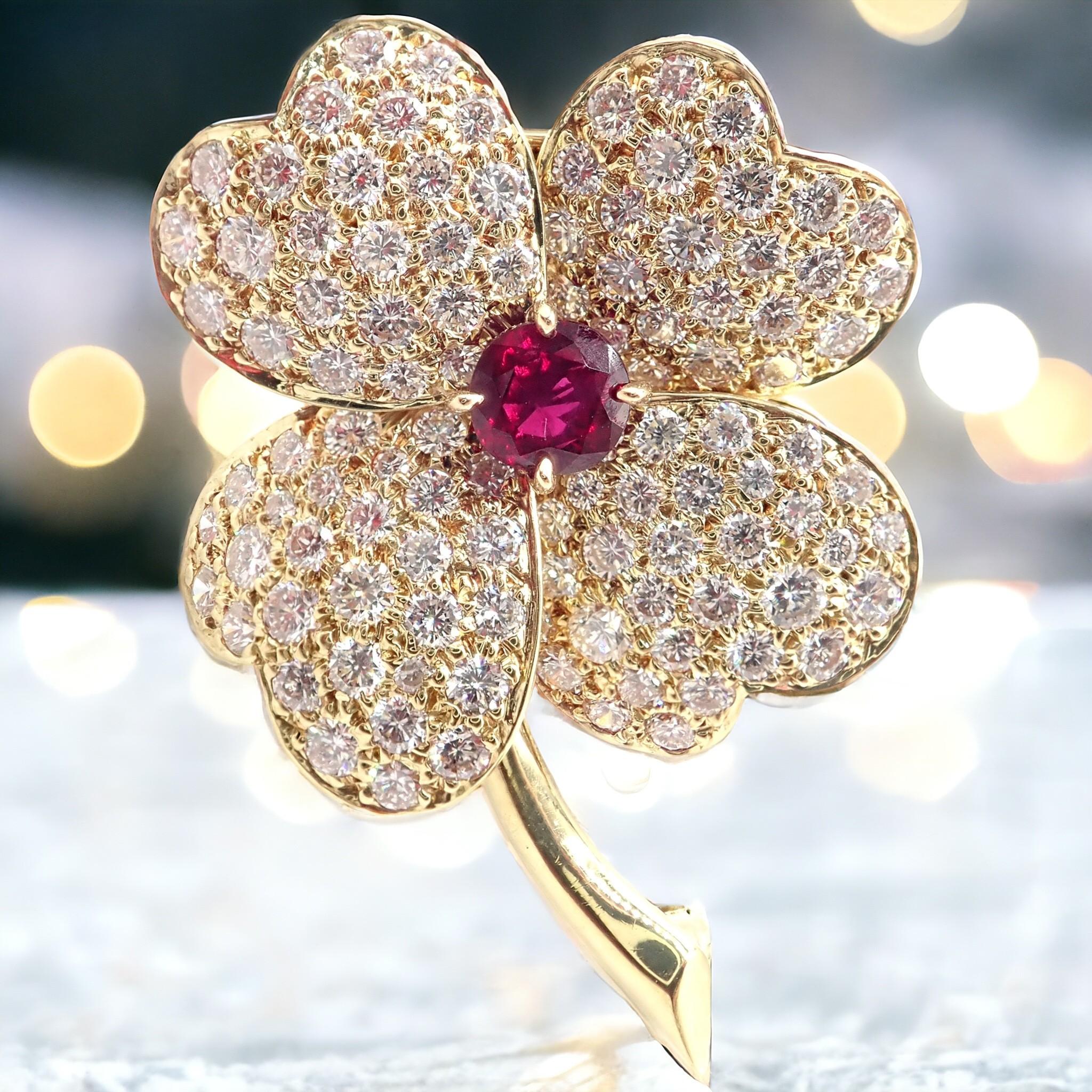 18k Yellow Gold Diamond And Ruby Cosmos Pendant Brooch by Van Cleef & Arpels
This vintage Van Cleef & Arpels Cosmos Brooch Pendant is a stunning piece, crafted from 18k yellow gold. 
It features an elegant, floral-inspired design, beautifully