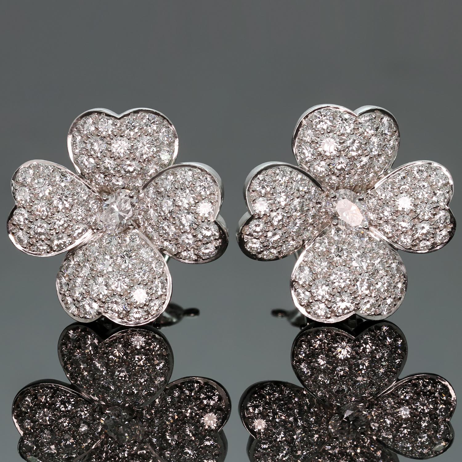 These exquisite large model clip-on earrings from the Cosmos collection by Van Cleef & Arpels feature a delicate flower design crafted in platinum and set with brilliant-cut round diamonds of an estimated 5.0 - 5.50 carats. Made in France circa