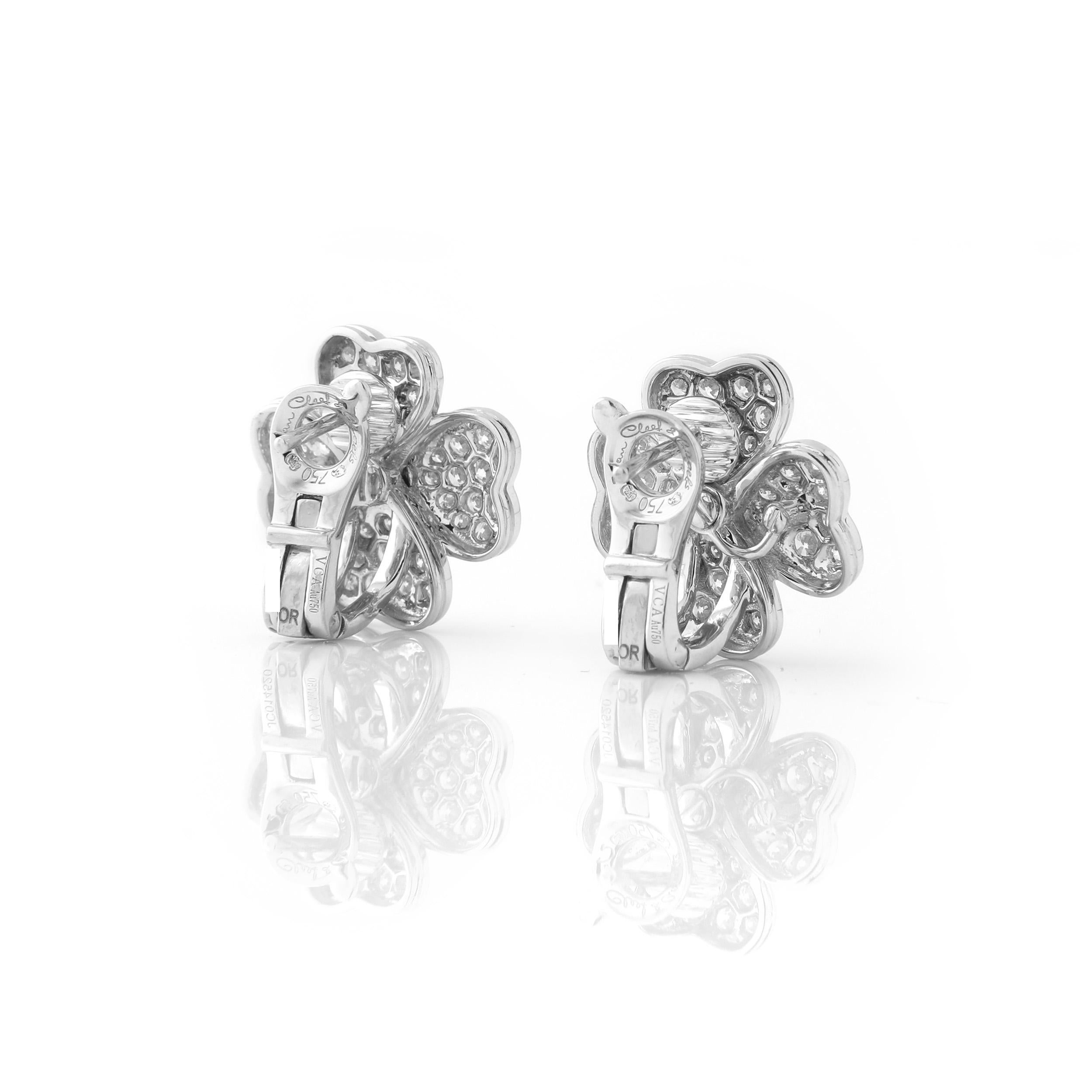 Van Cleef & Arpels 18k white gold and diamond “Cosmos” earrings with posts, small model. Signed Van Cleef & Arpels with serial number and french marks. In excellent condition with no signs of wear.

Accompanied by the Certificate of Authenticity and