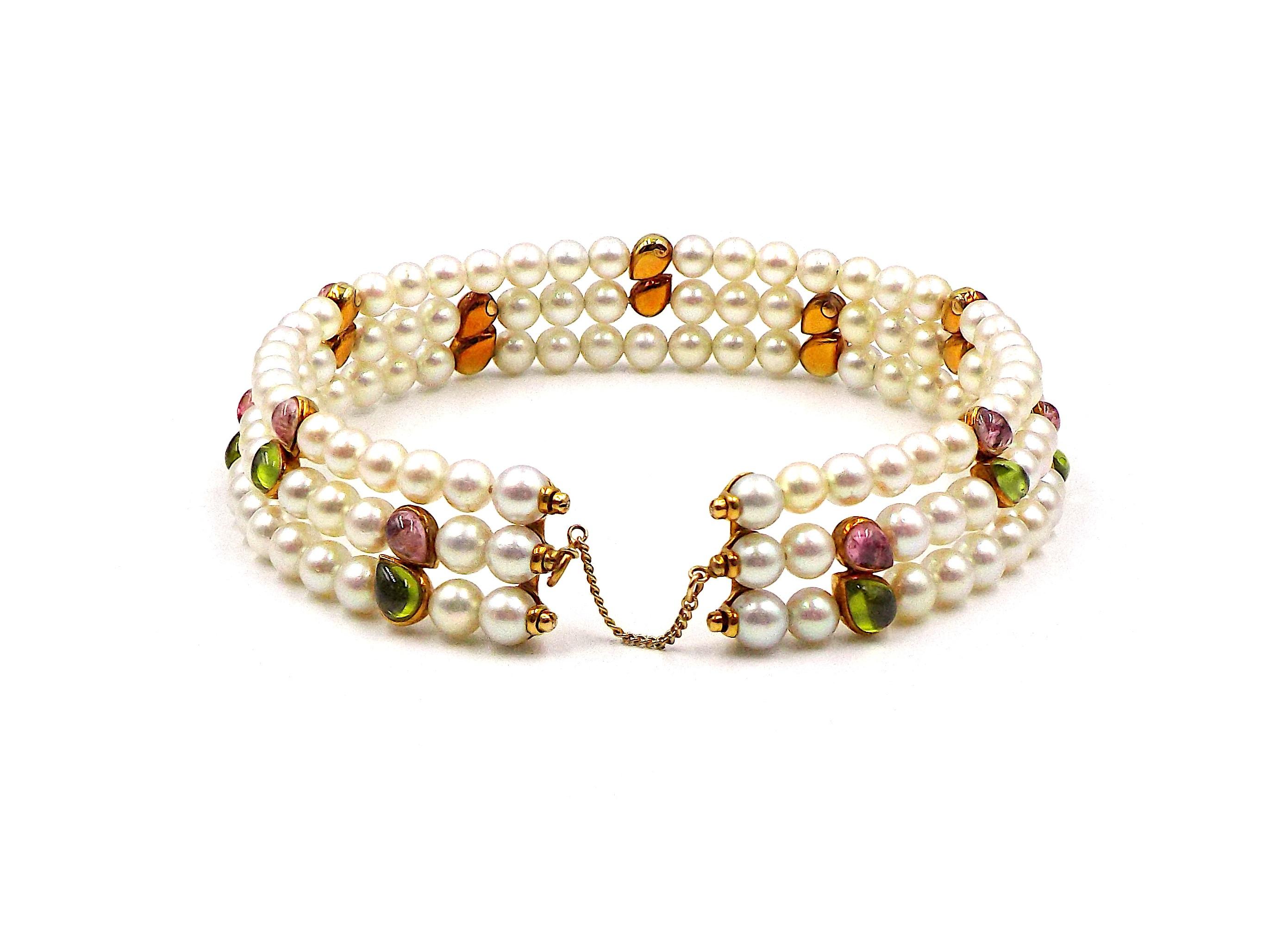 A semi-flexible choker containing three rows of pearls measuring approximately 6.50-7.00 mm in diameter, interspersed with yellow gold stations containing pear cabochon pink tourmalines and peridots, together with a matching semi-flexible cuff