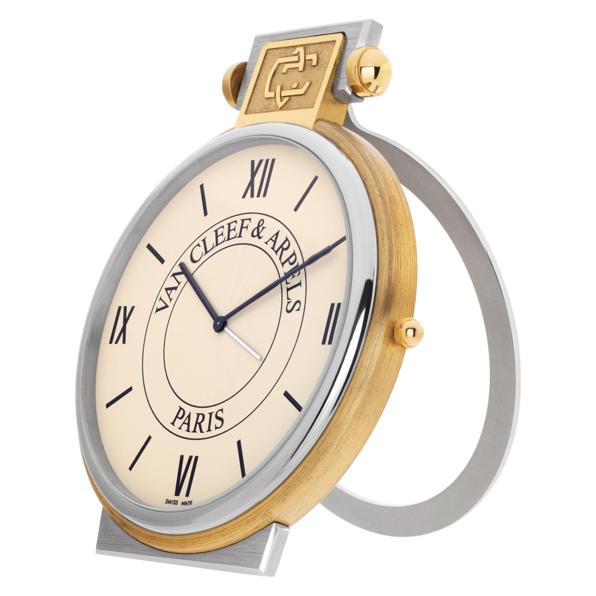 Van Cleef & Arpels No.22 Travel Alarm Clock in gold & stainless steel. Circa 1990s. Quartz. Ref 820.P06. Fine Pre-owned Van Cleef & Arpels Watch. Certified preowned Van Cleef & Arpels Desk Clock 820.P06 watch is made out of yellow gold. This Van