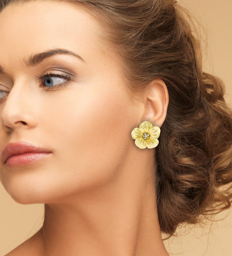 From Van Cleef & Arpels, these beautiful earrings are from the Magnolia collection.
• Metal:18 Karat Yellow Gold	
• Circa: 1980s
• Gemstone: 12 Diamonds=.85 carats
• Weight: 22.6 grams
• Dimensions:  1 ¾ x 1 ¾ inches
• Packaging:  Pampillonia
